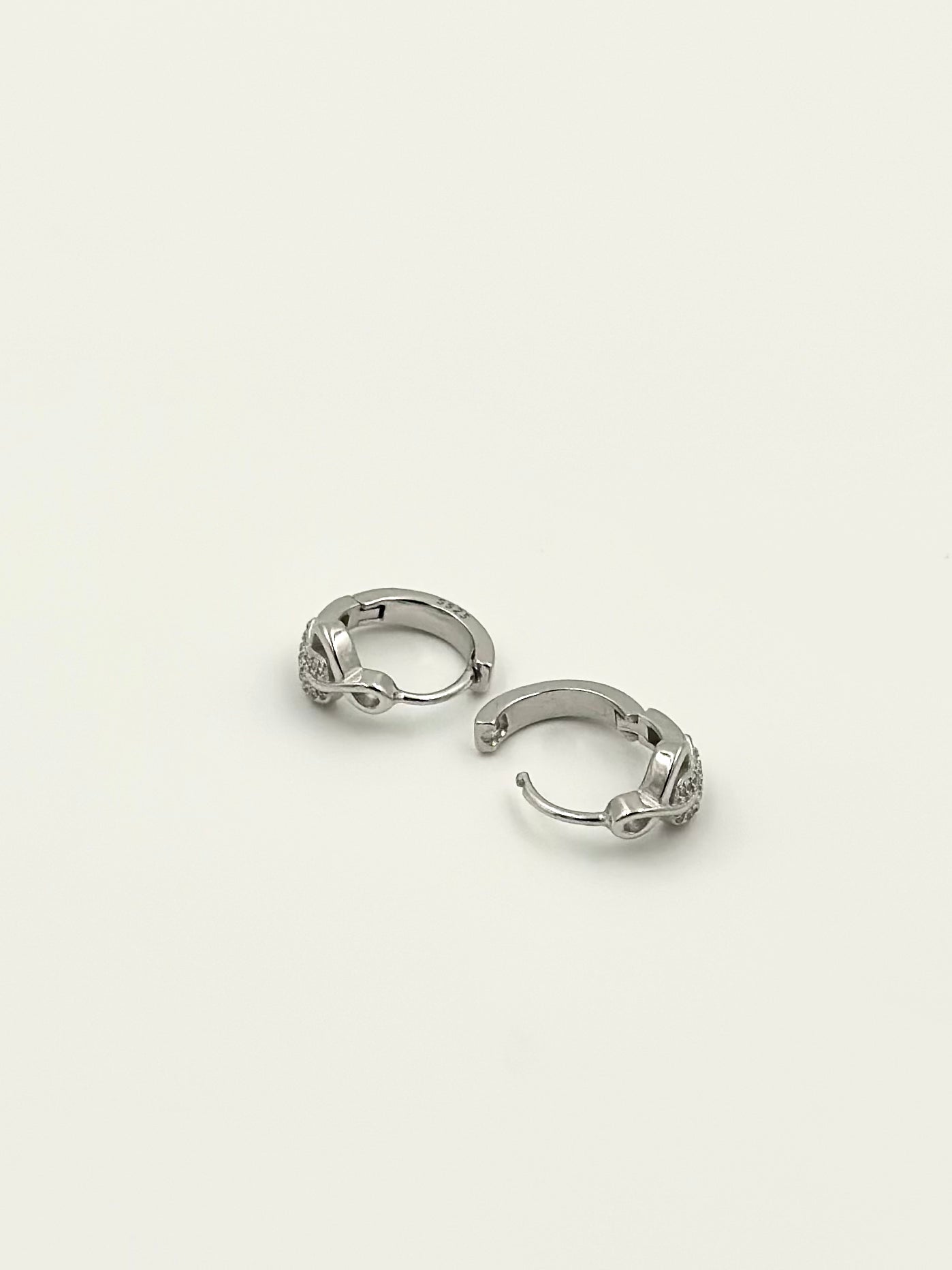 Zircon studded sterliing silver bali with infinity design