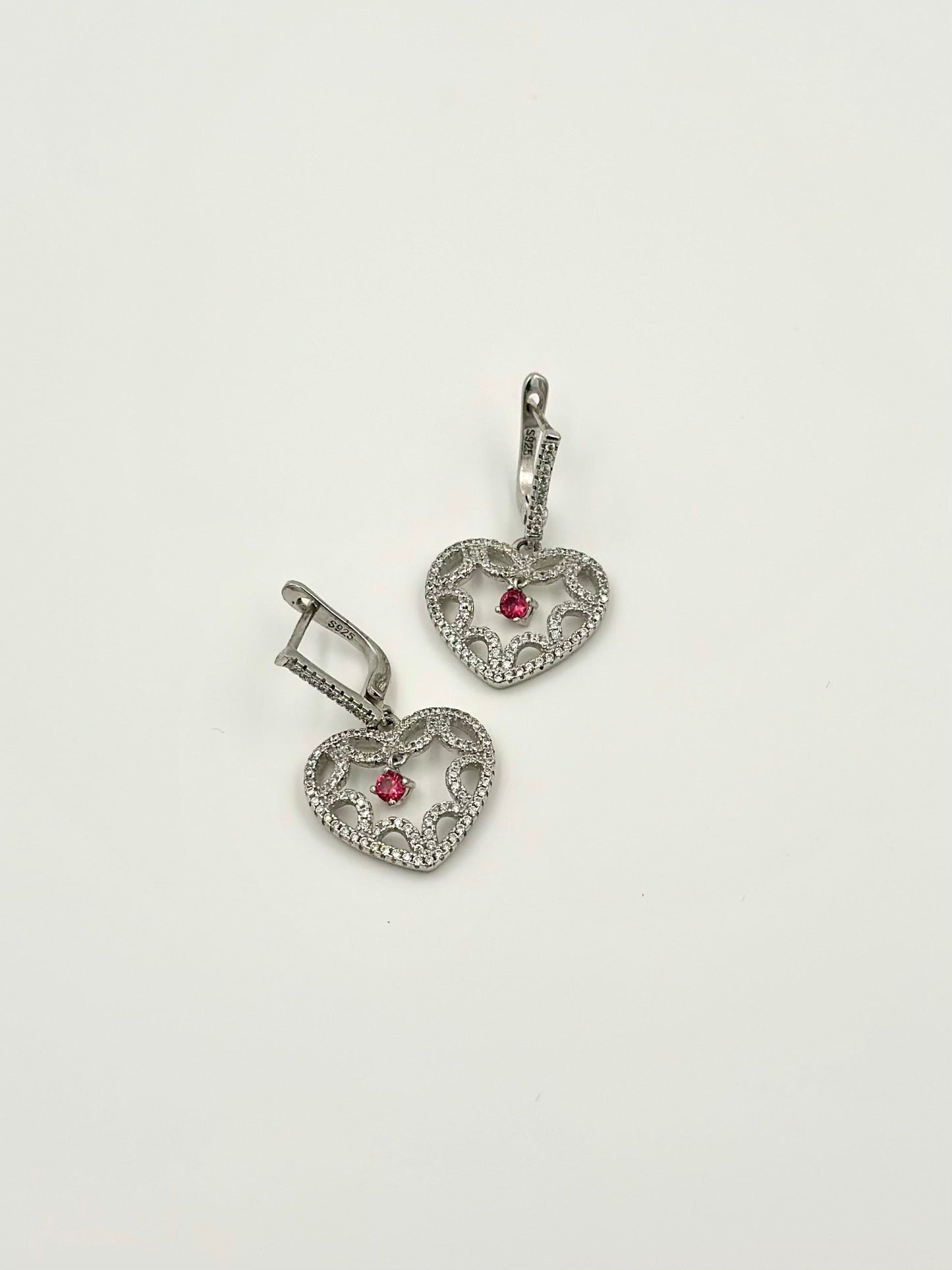 Heart shaped sterling silver bali with small ruby stone as centre piece