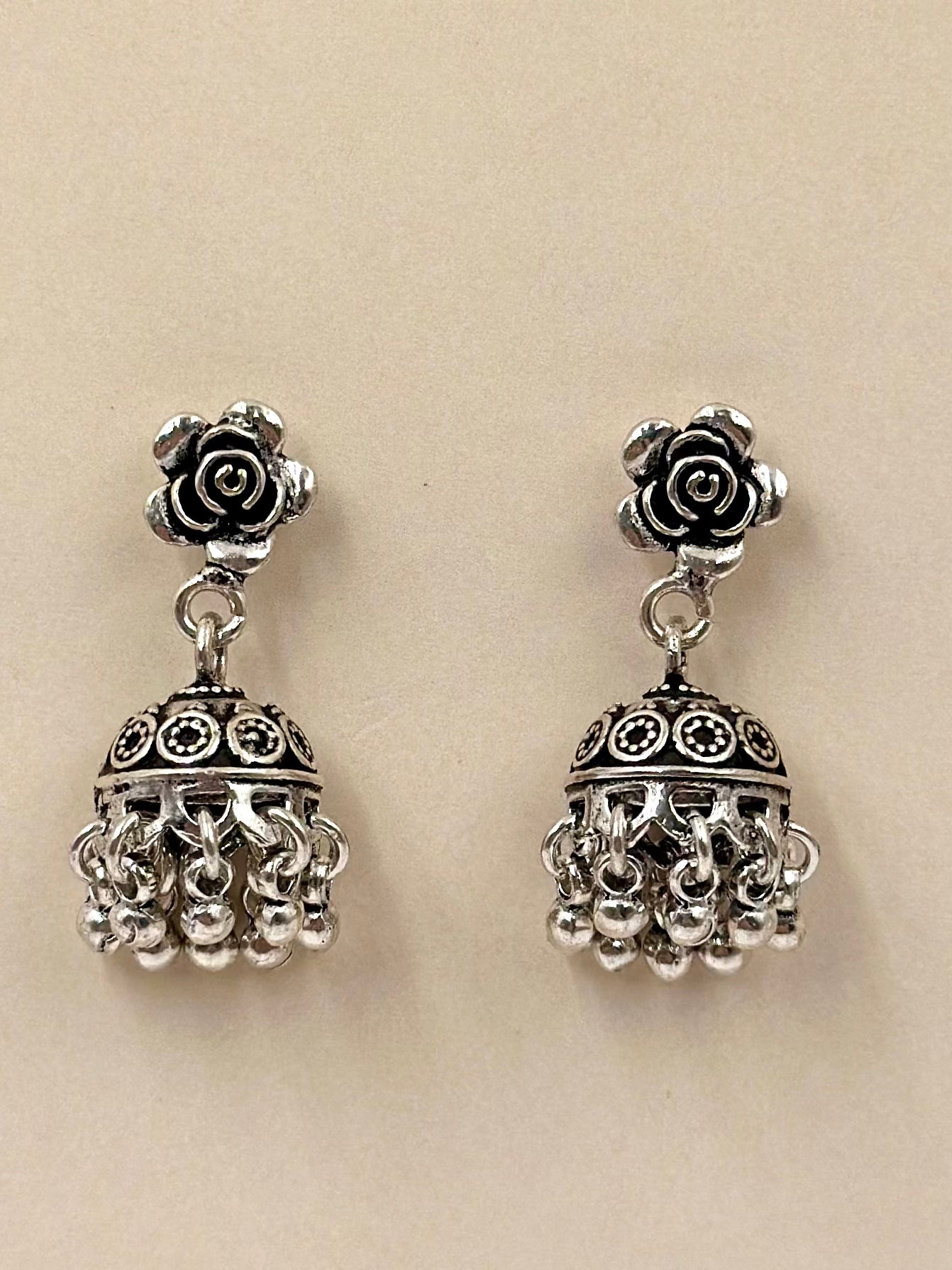 Rose shaped, oxidised sterling silver jhumkas with heartly patterns