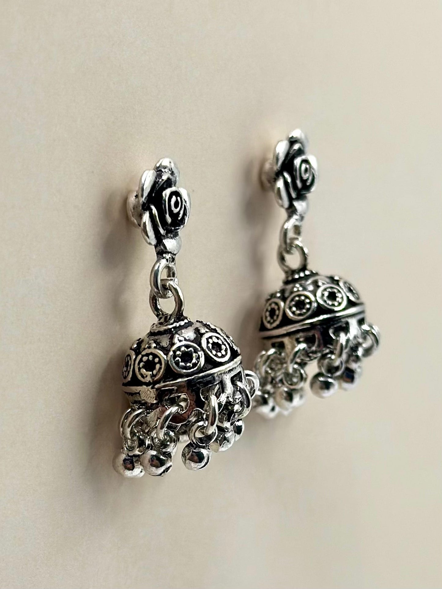 Rose shaped, oxidised sterling silver jhumkas with heartly patterns