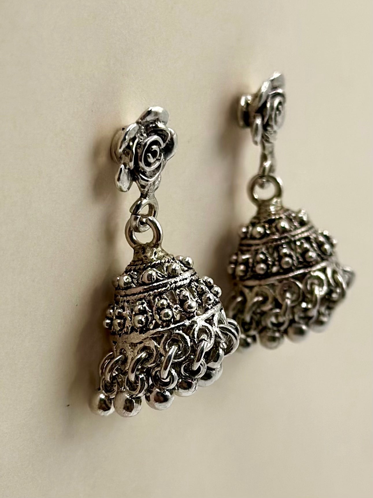 Rose shaped, oxidised sterling silver jhumkas with heartly patterns