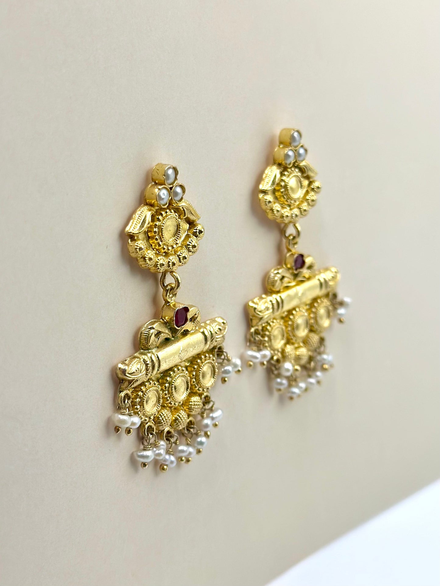 Gold plated, studded with pearls and a centre red stone, sterling silver danglers
