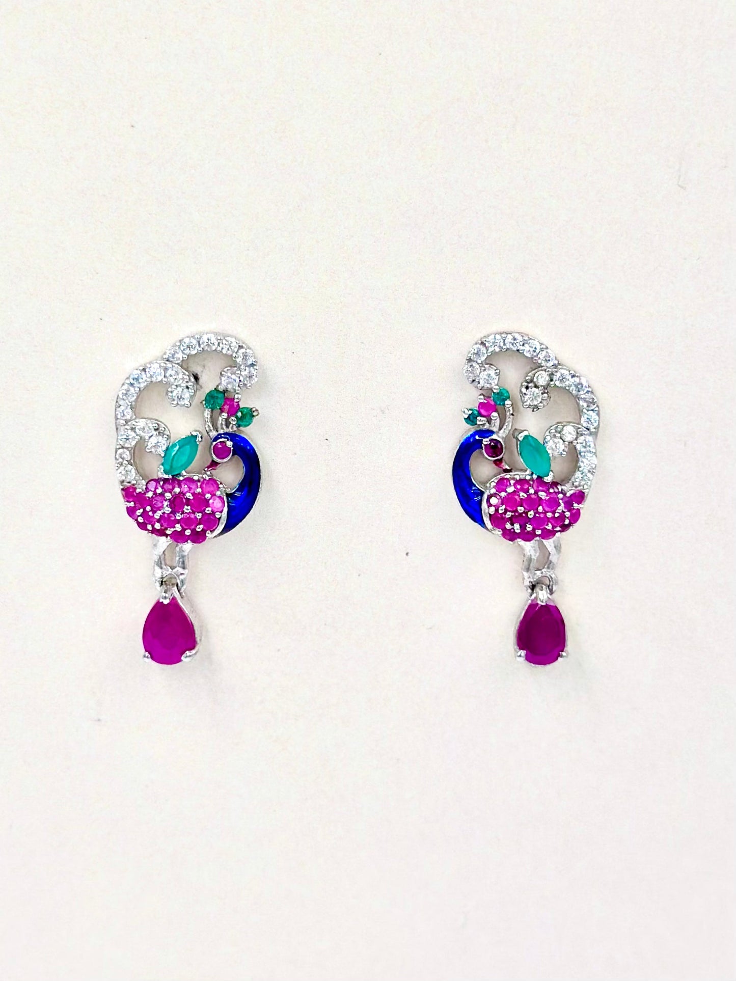 Pink stones, zircon studded, peacock shaped sterling silver danglers