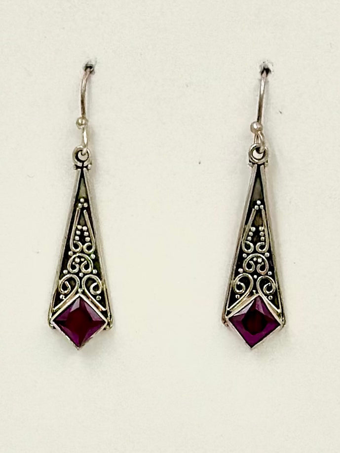 Sterling silver drop earrings studded with a ruby stone and fine oxidised detailing