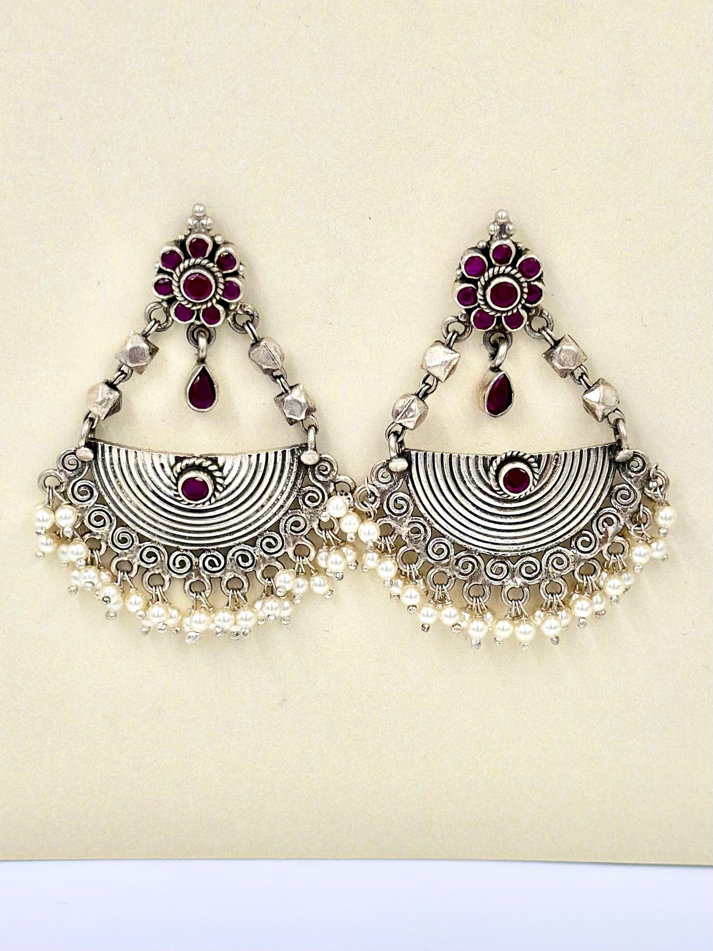 half disc shaped, fancy stones and pearls studded, oxidised sterling silver danglers
