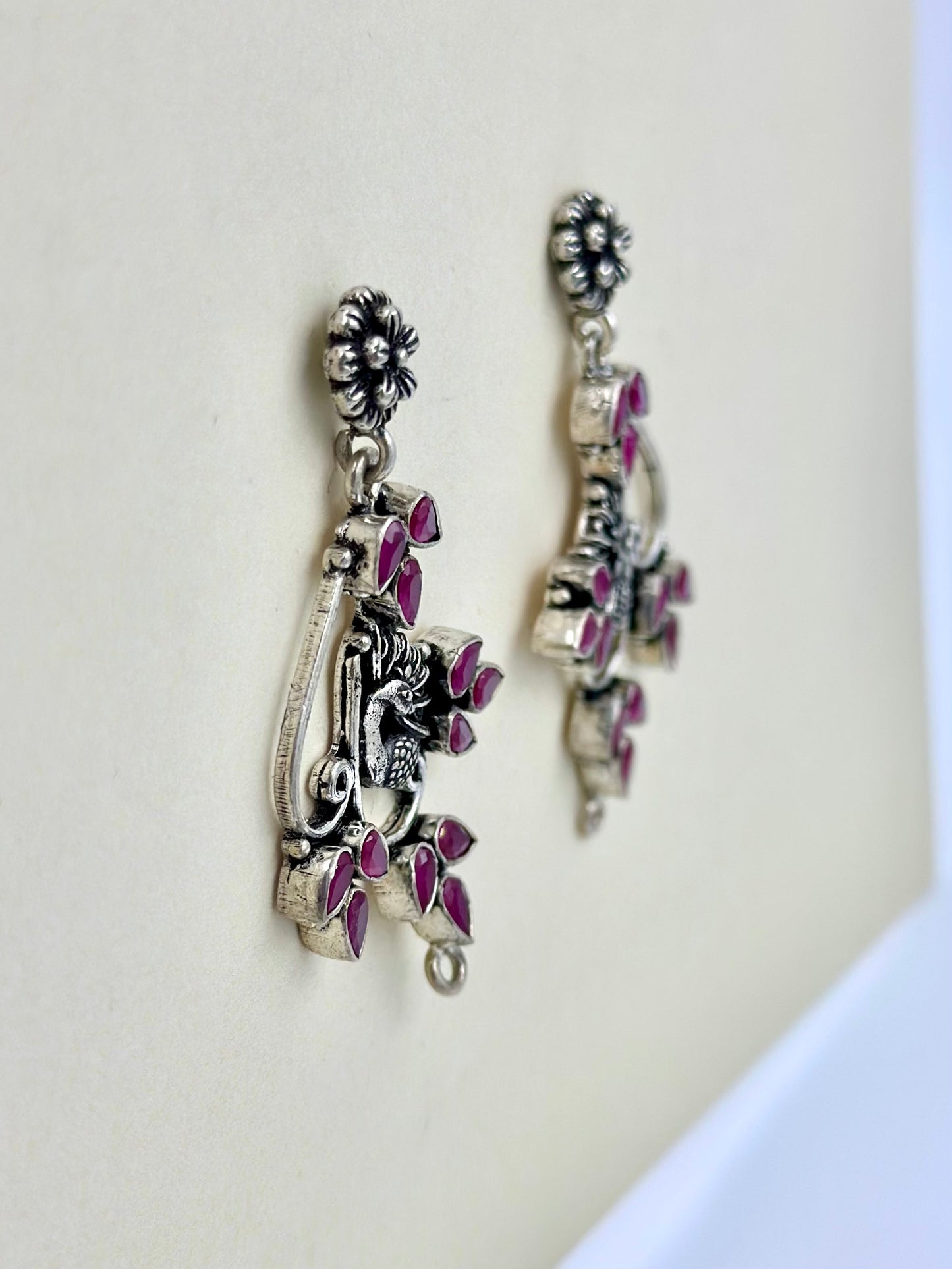 fancy stones studded, peacock shaped, oxidised sterling silver danglers