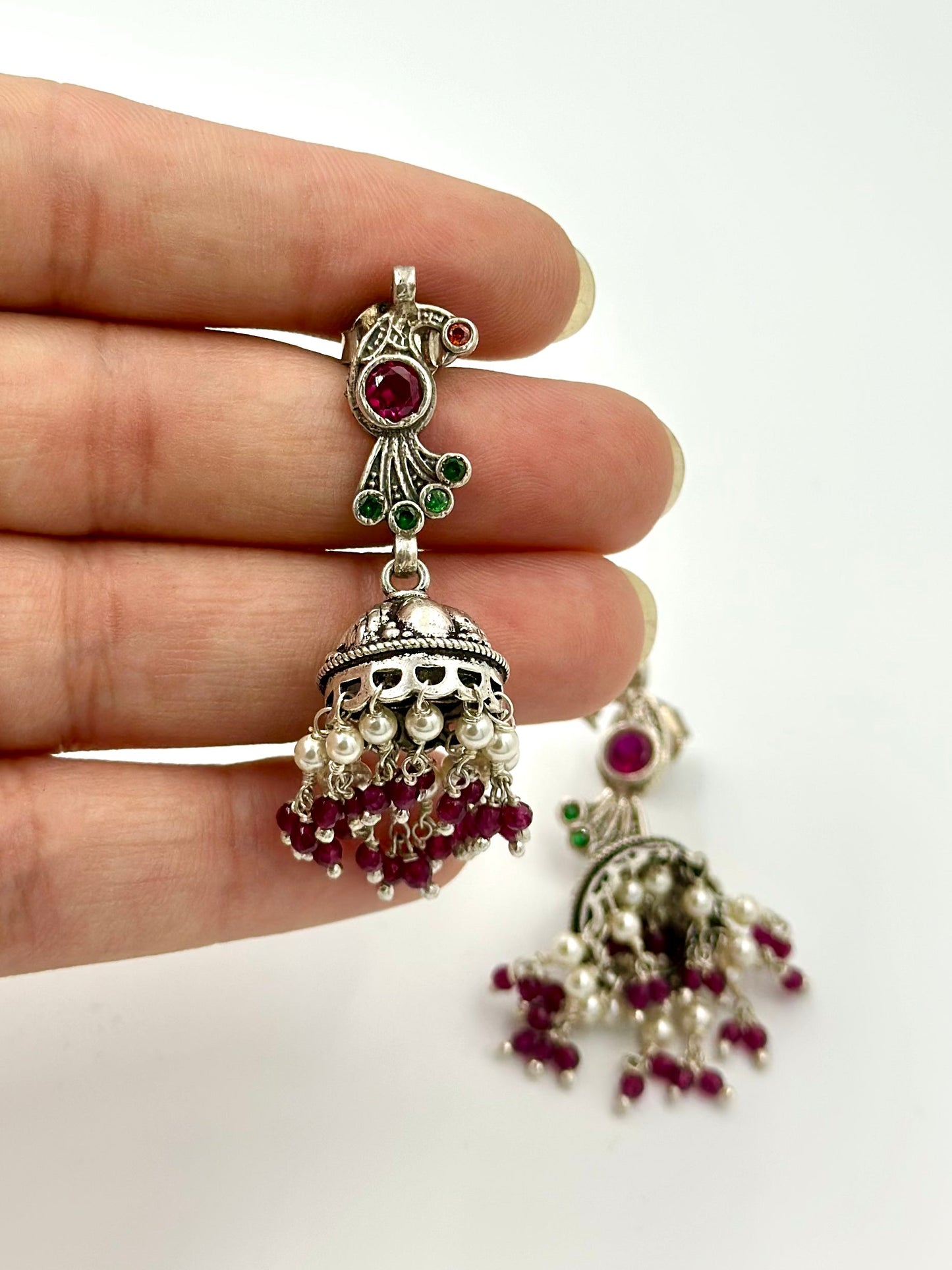 Fancy stones studded, peacock shaped, oxidised sterling silver jhumkas