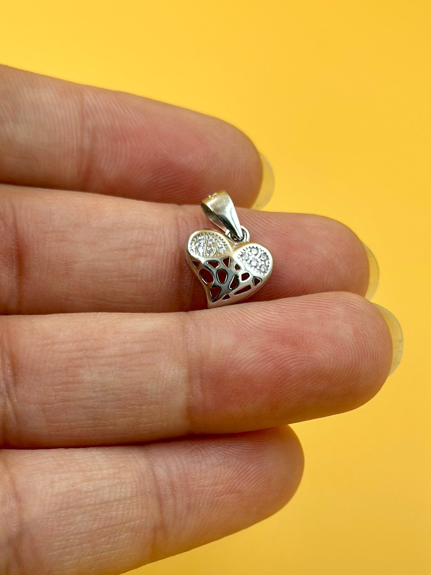 Zircon studded with fine detailing, heart shaped sterling silver pendant