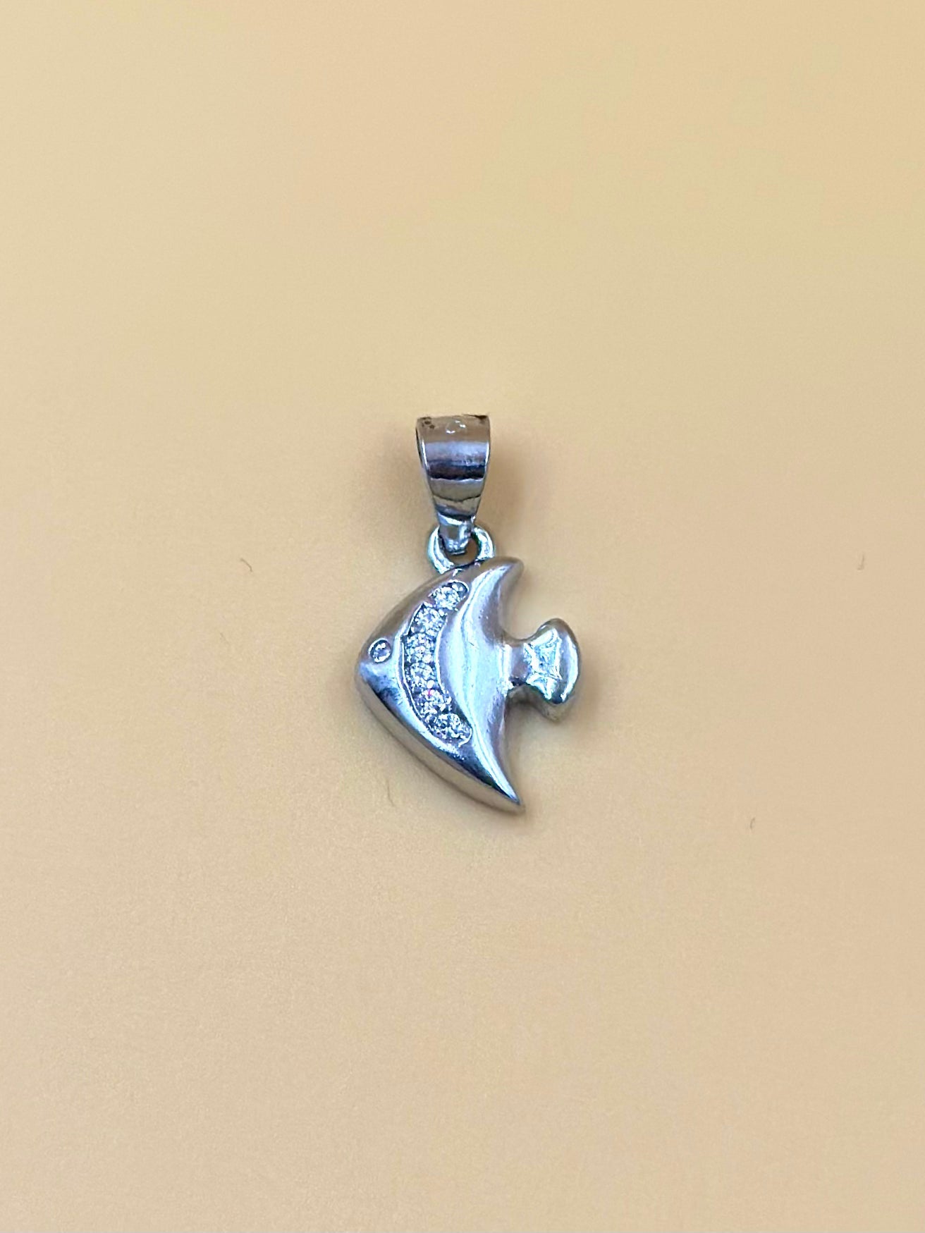 Zircon studded, fish shaped sterling silver pendant