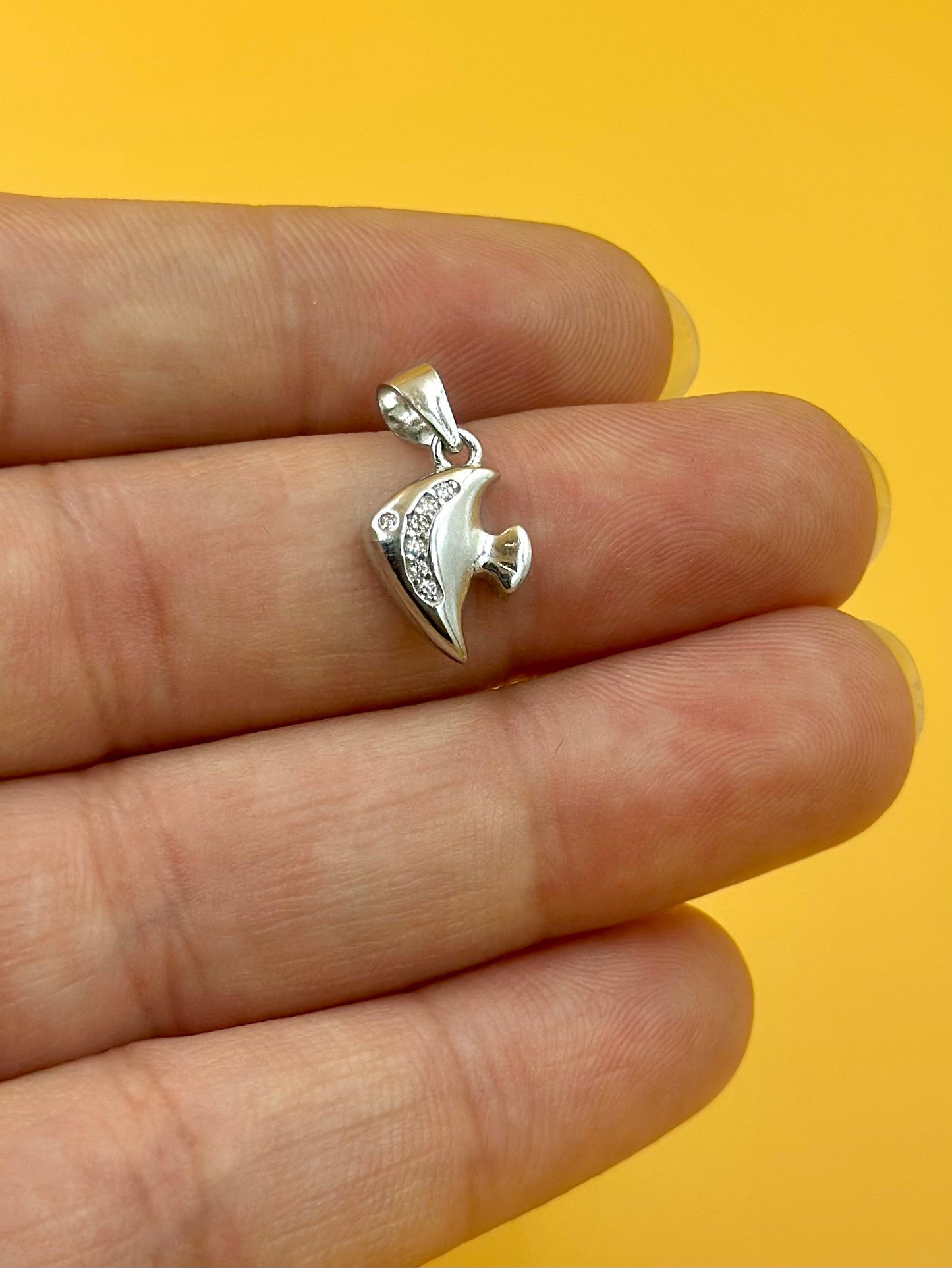 Zircon studded, fish shaped sterling silver pendant