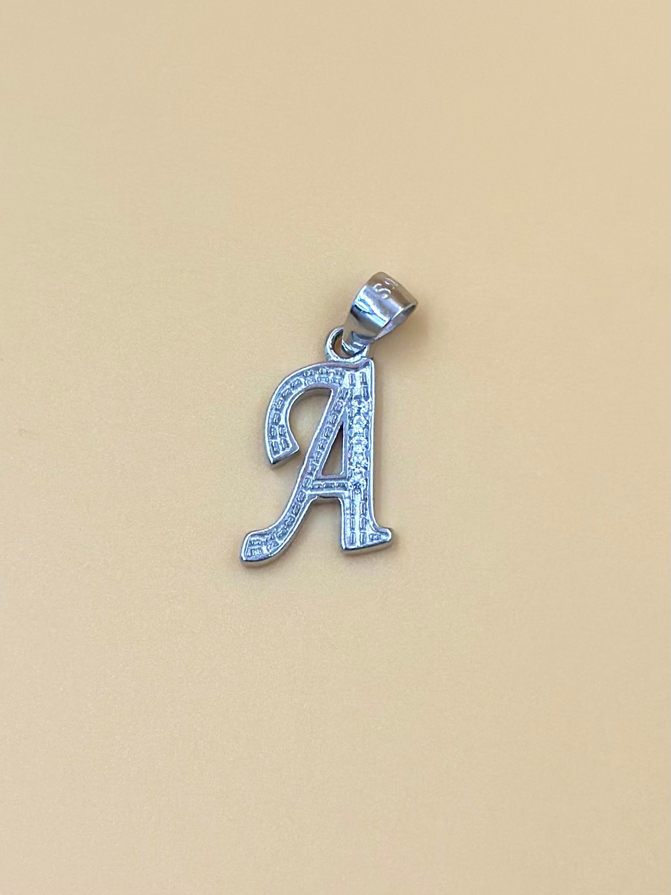 A shaped, zircon studded sterling silver pendant