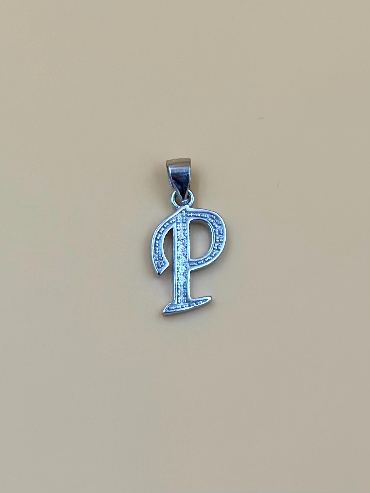 P shaped, zircon studded sterling silver pendant