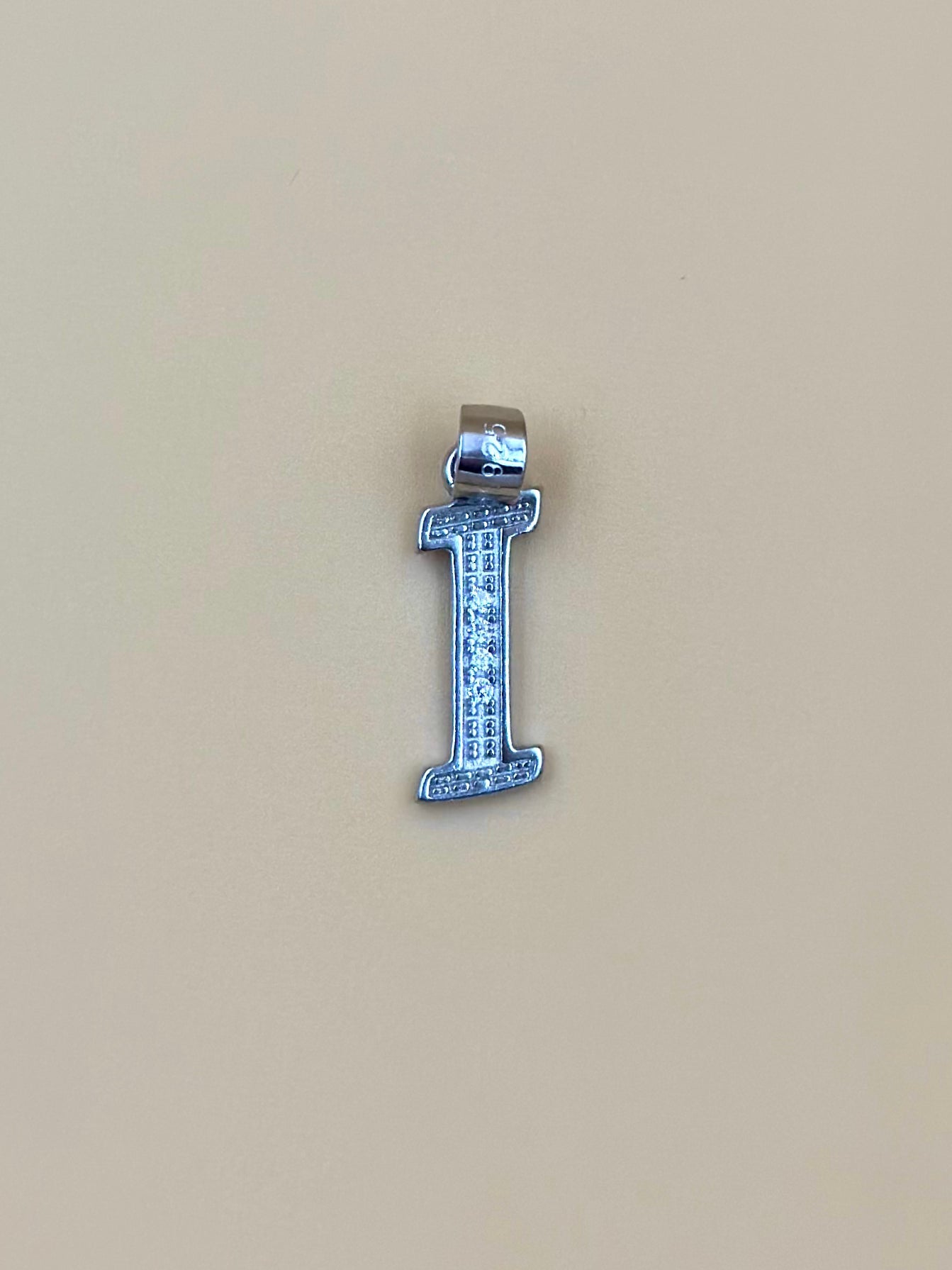 I shaped, zircon studded sterling silver pendant
