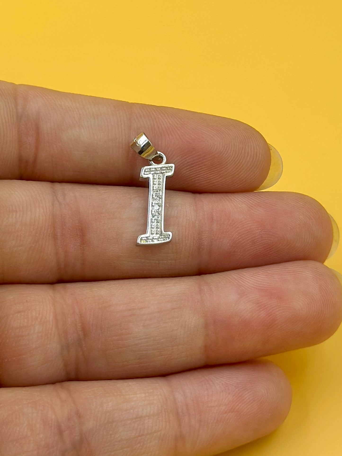 I shaped, zircon studded sterling silver pendant