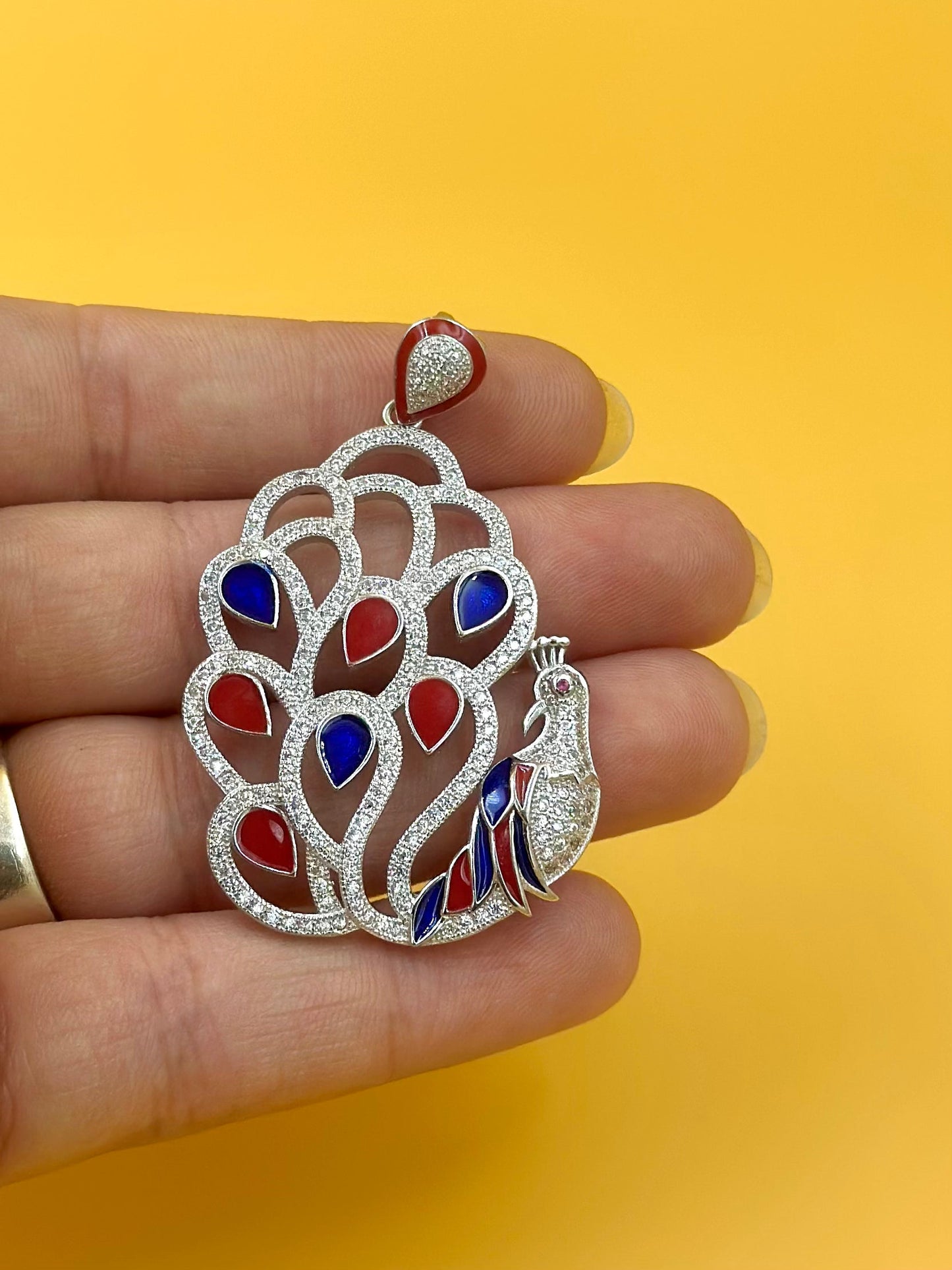 Zircon studded, enamel coated, peacock shaped sterling silver pendant