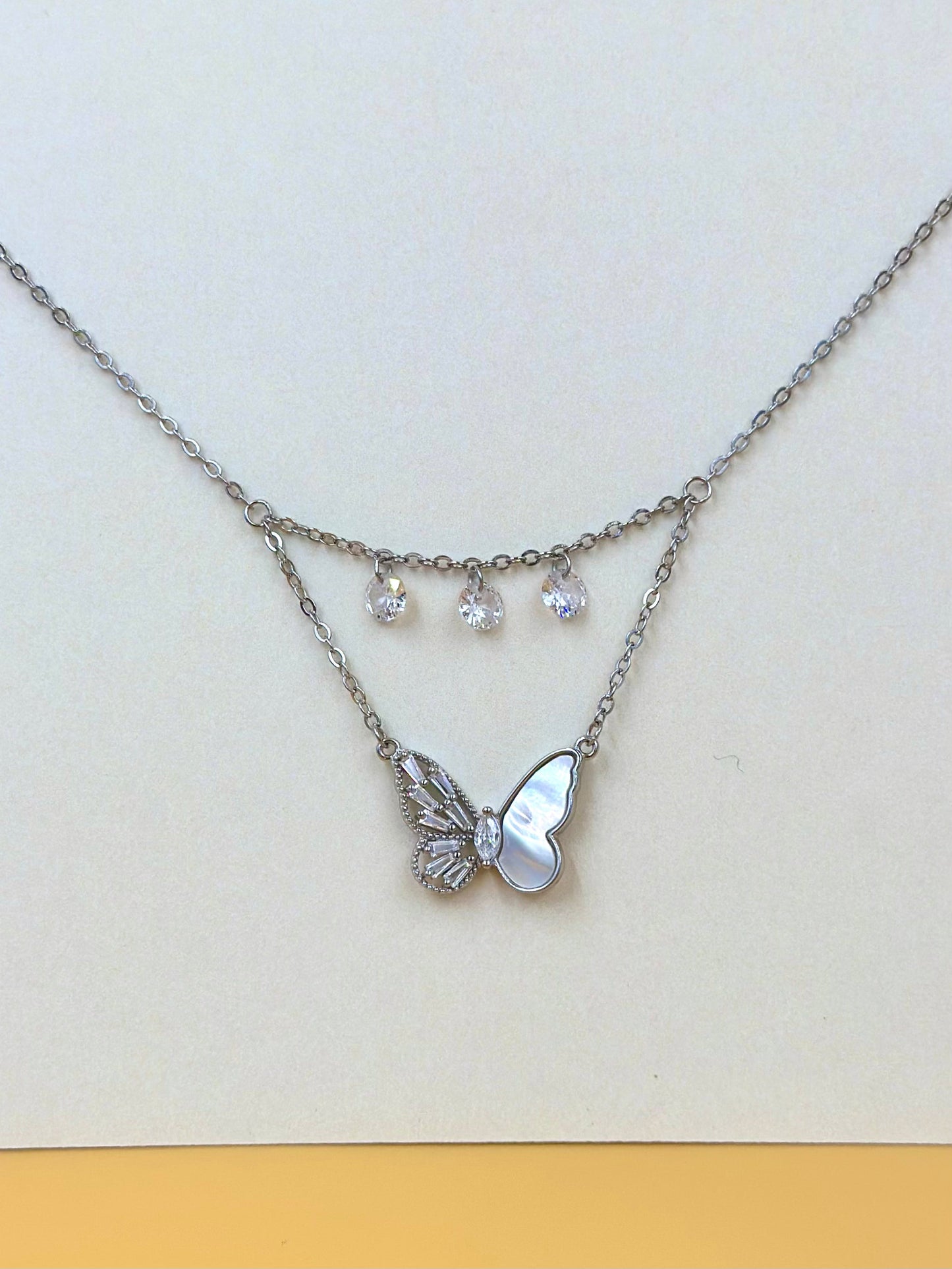 Zircon studded, butterfly shaped sterling silver pendant chain