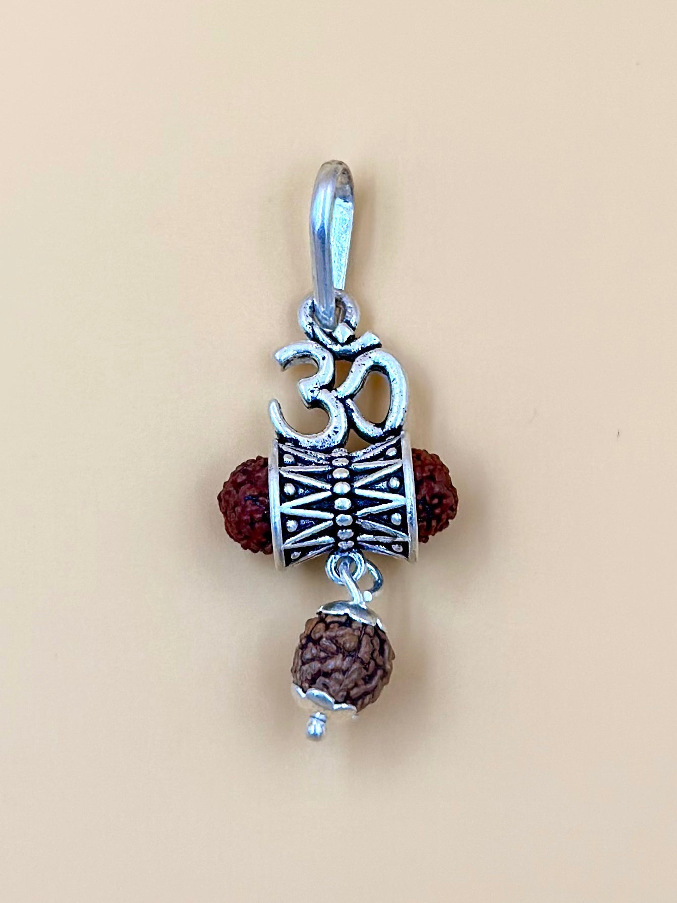 Oxidised, om shaped sterling silver idol pendant