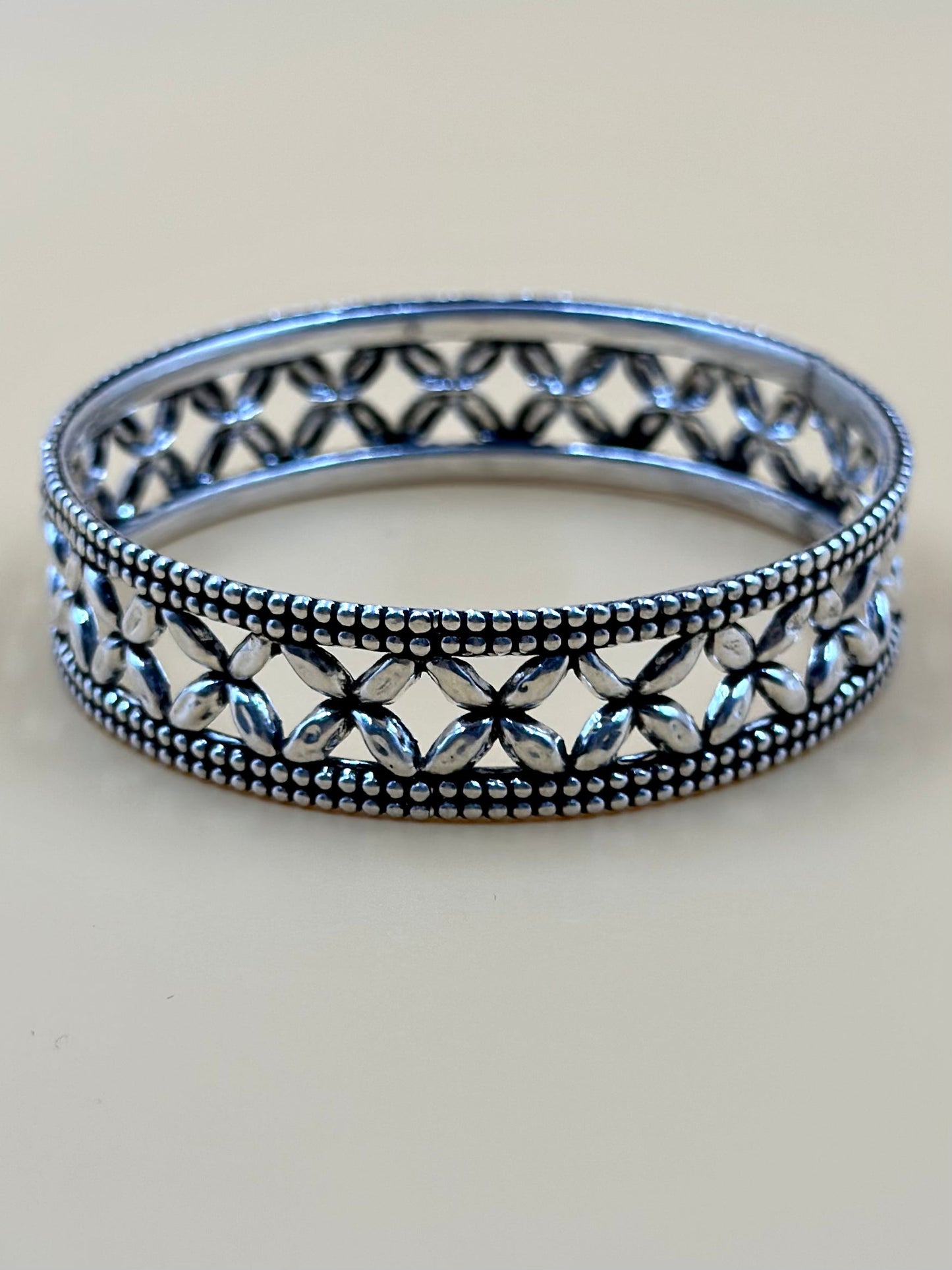 Oxidised, flower shaped sterling silver kada