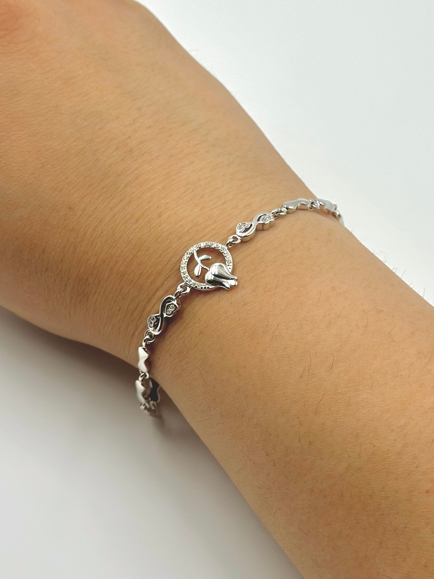 Zircon studded, rose design sterling silver link bracelet