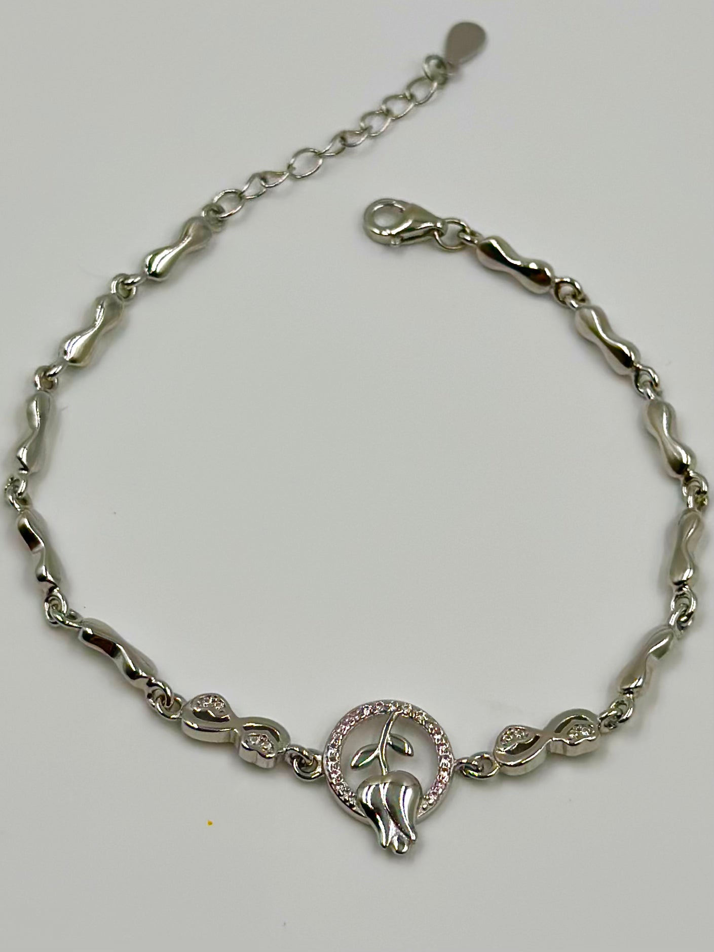 Zircon studded, rose design sterling silver link bracelet