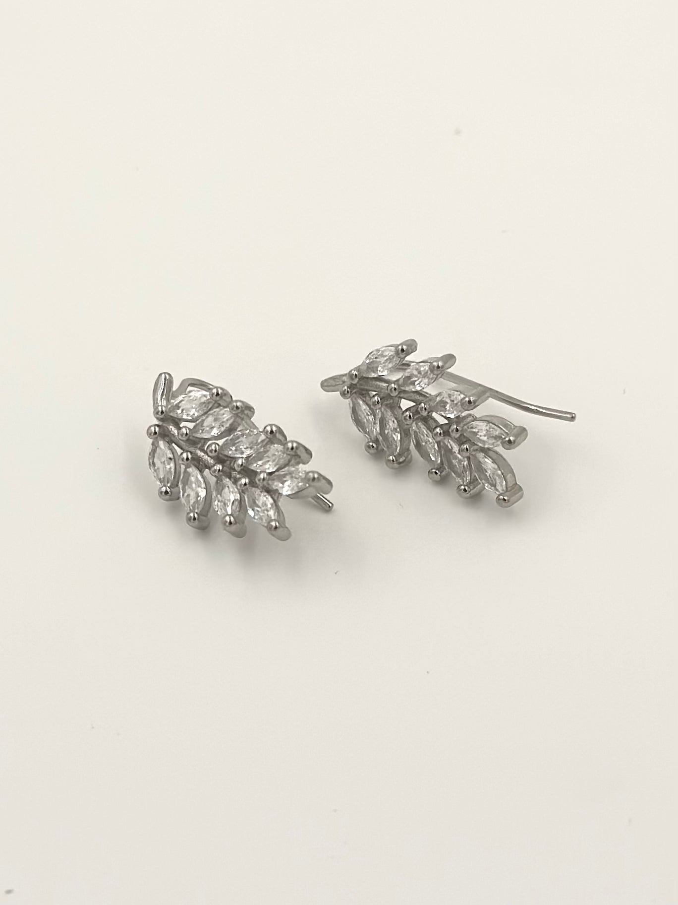 Sterling silver drop earrings in leaf shape, studded with zircon