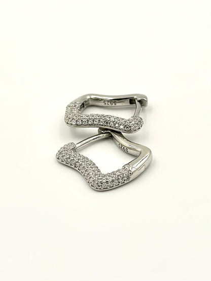 Curvy shaped sterling silver bali studded with zircon