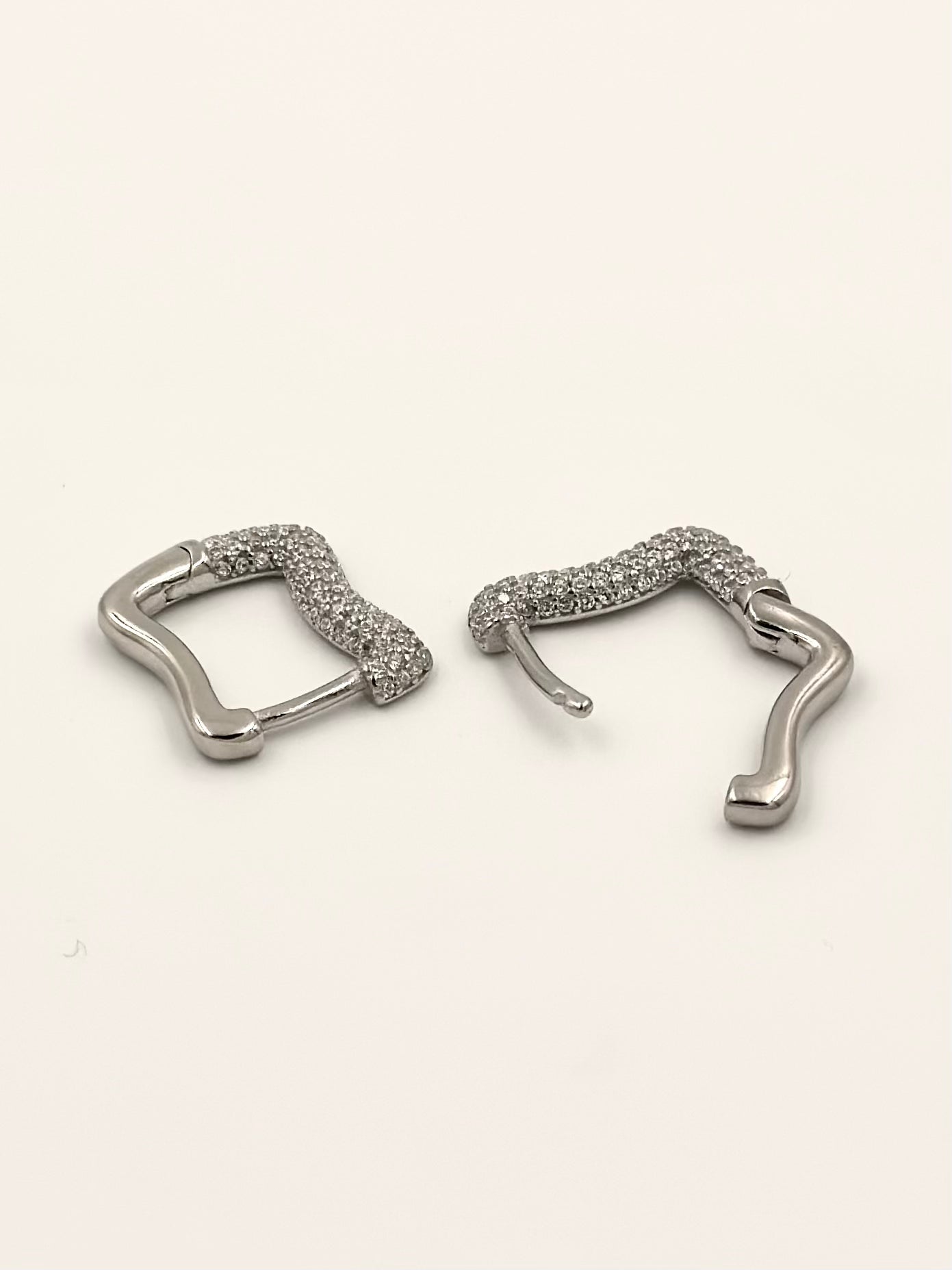 Curvy shaped sterling silver bali studded with zircon