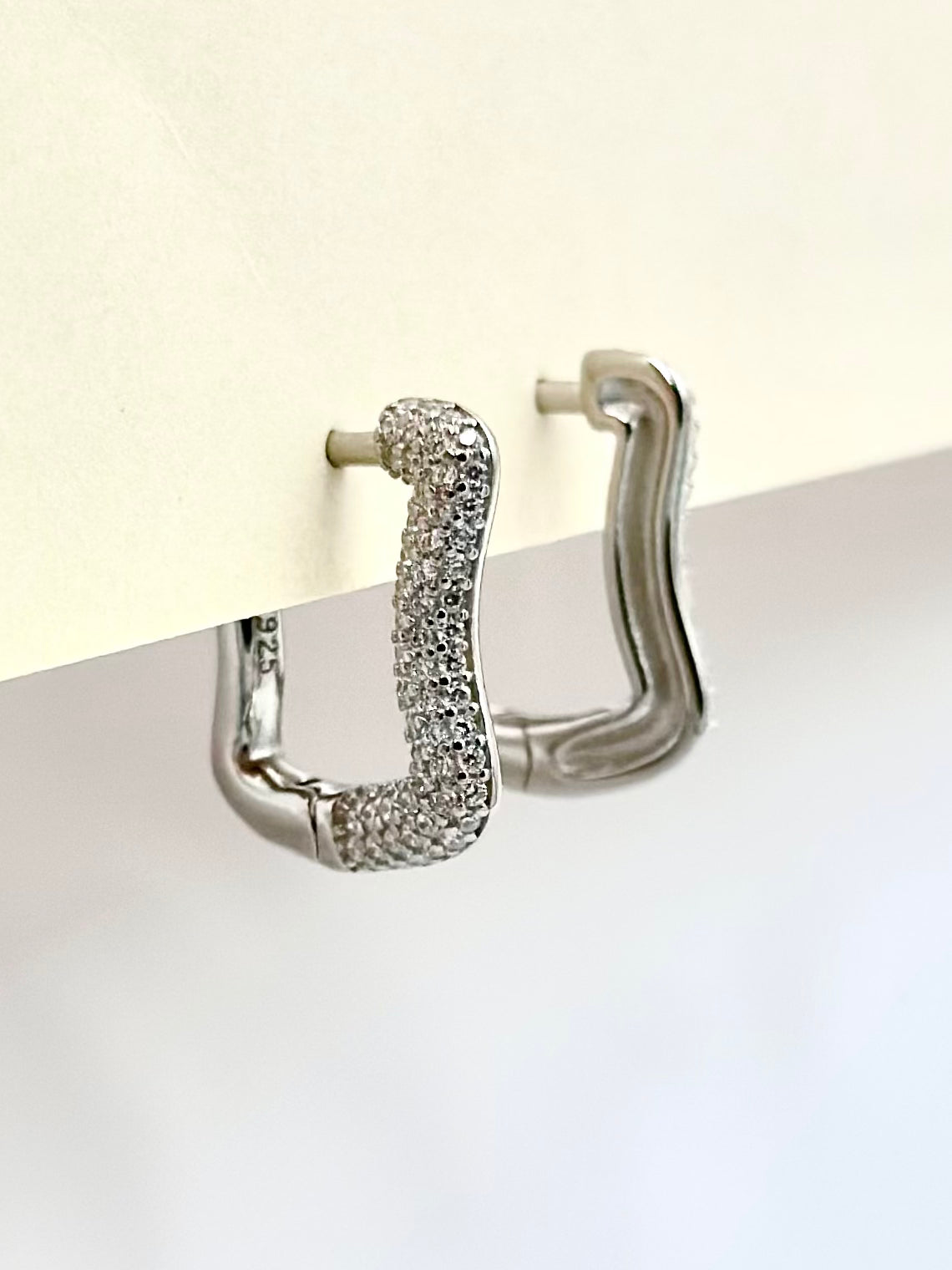 Curvy shaped sterling silver bali studded with zircon