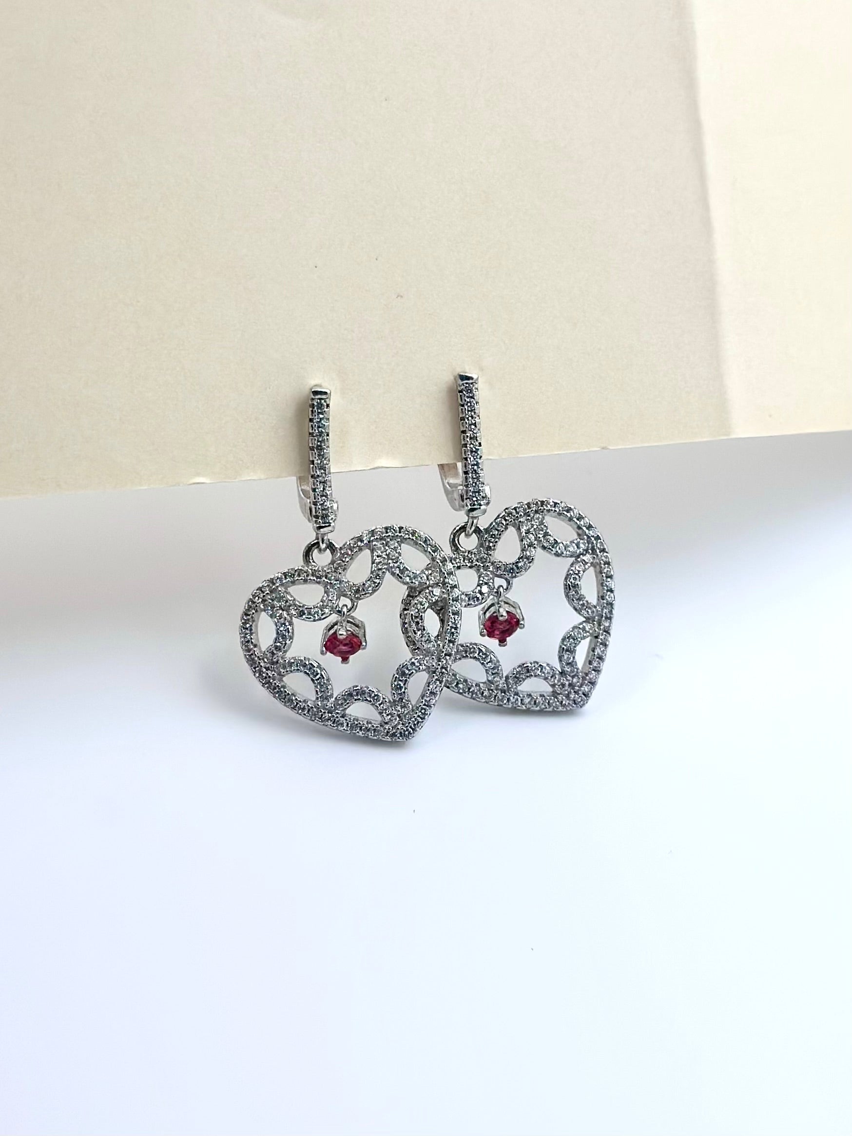Heart shaped sterling silver bali with small ruby stone as centre piece