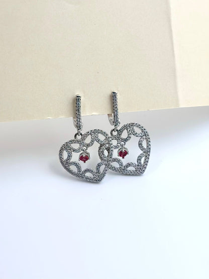 Heart shaped sterling silver bali with small ruby stone as centre piece