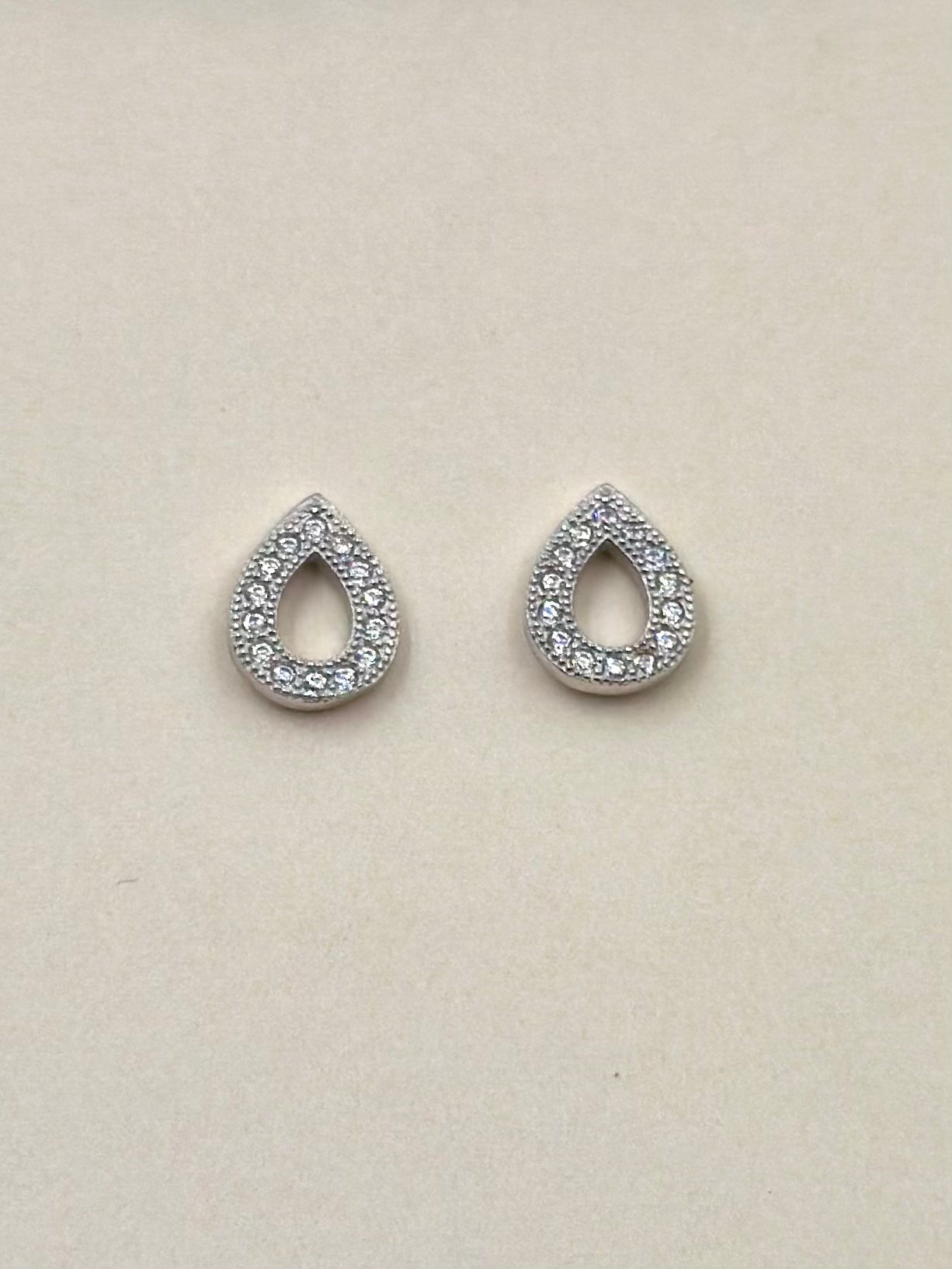 Zircon studded, transformable, drops shaped, sterling silver danglers and studs