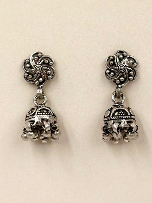Oxidised, swirl flower shaped sterling silver jhumkas with fine details
