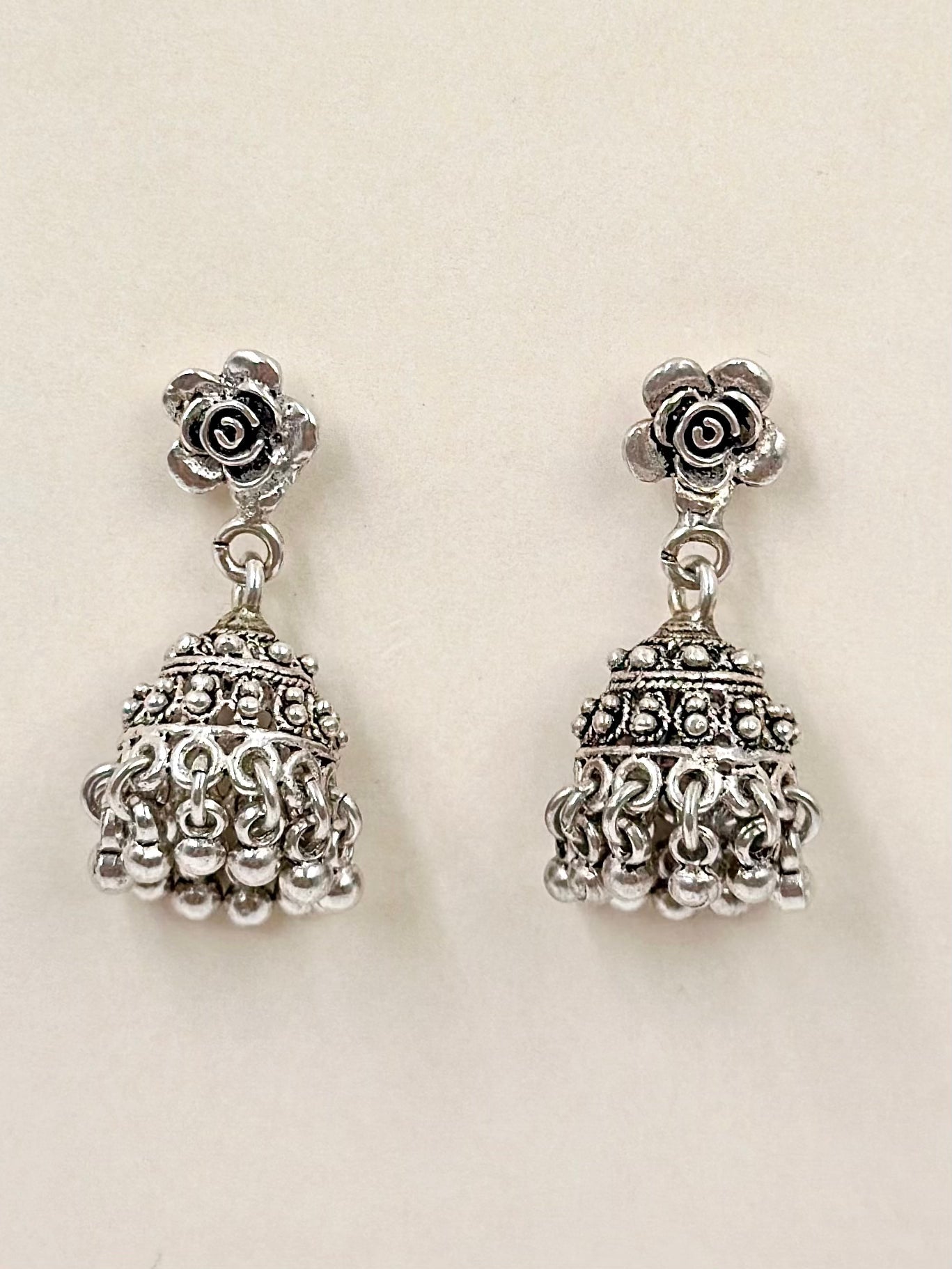 Rose shaped, oxidised sterling silver jhumkas with heartly patterns