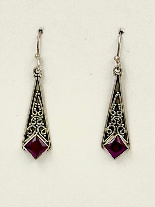 Sterling silver drop earrings studded with a ruby stone and fine oxidised detailing