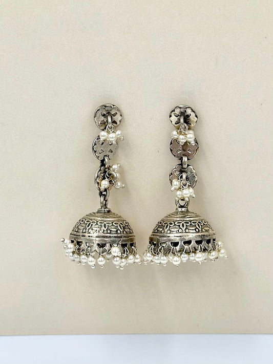 adorned with pearls, oxidised sterling silver jhumkas with fine detailing