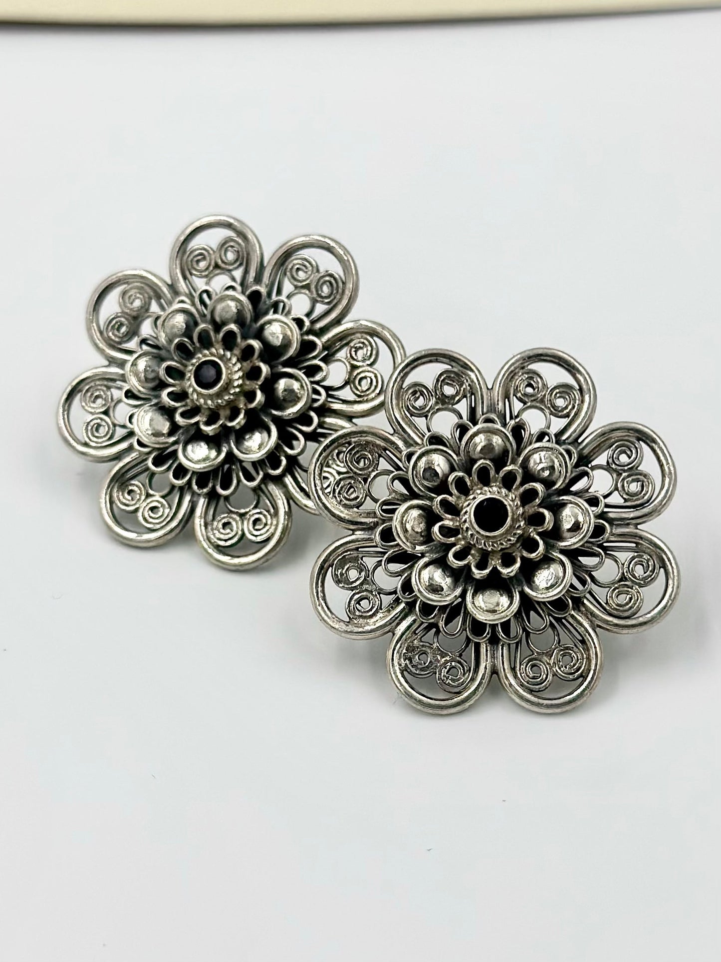 Oxidised, studded with fancy stone, sunflower shaped steroling silver studs with detailing