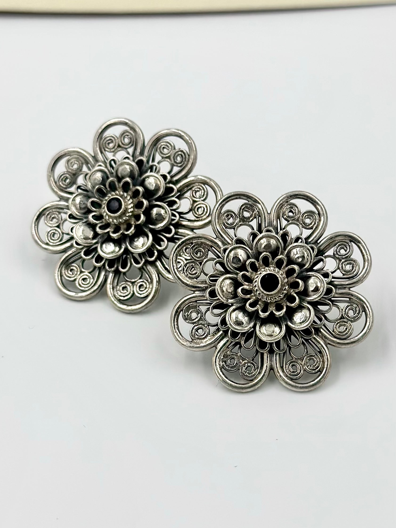 Oxidised, studded with fancy stone, sunflower shaped steroling silver studs with detailing