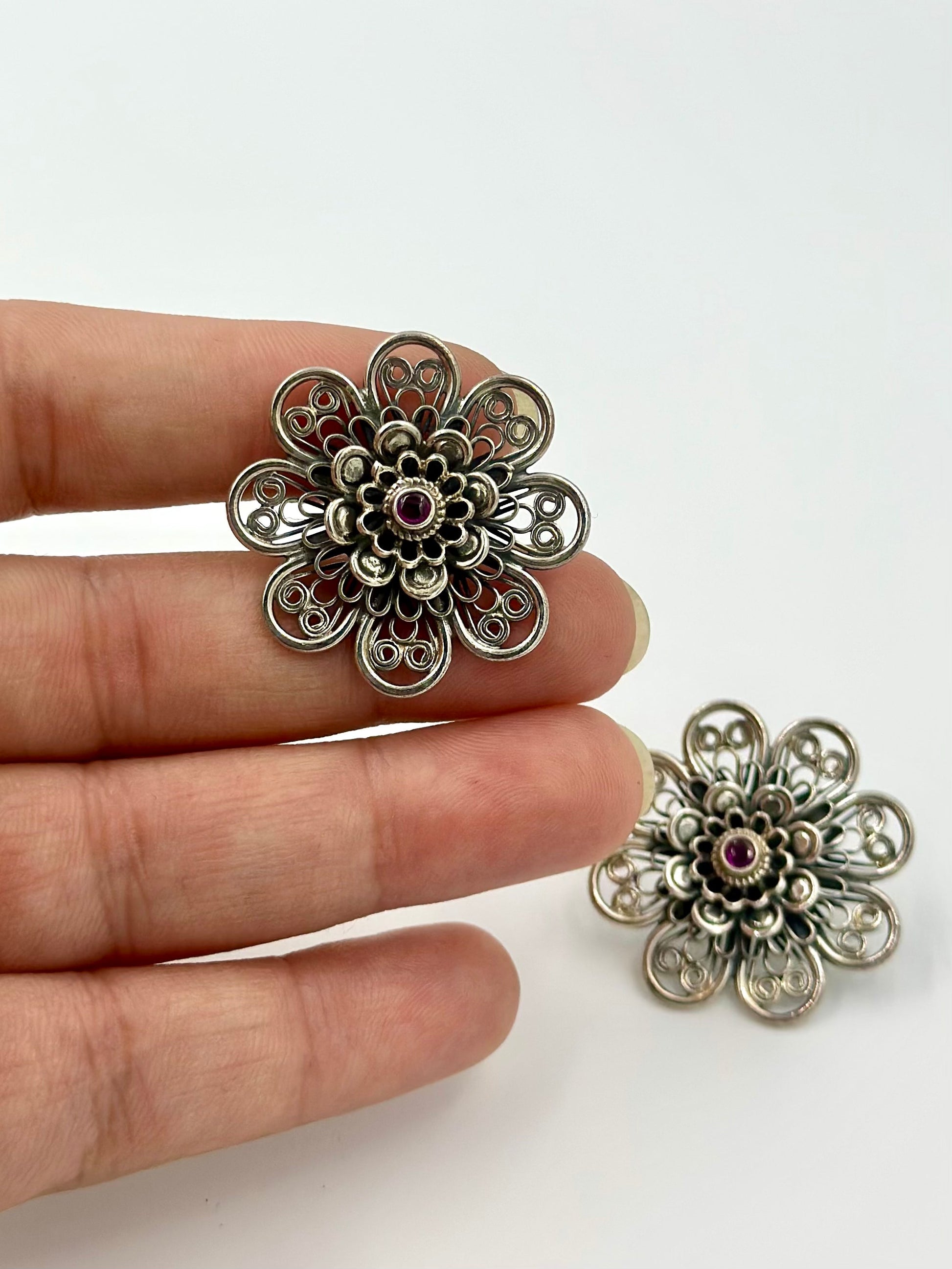 Oxidised, studded with fancy stone, sunflower shaped steroling silver studs with detailing