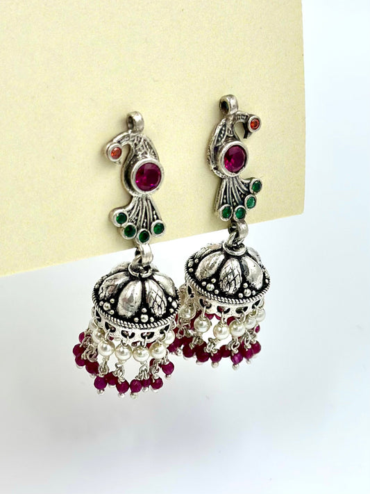 Fancy stones studded, peacock shaped, oxidised sterling silver jhumkas