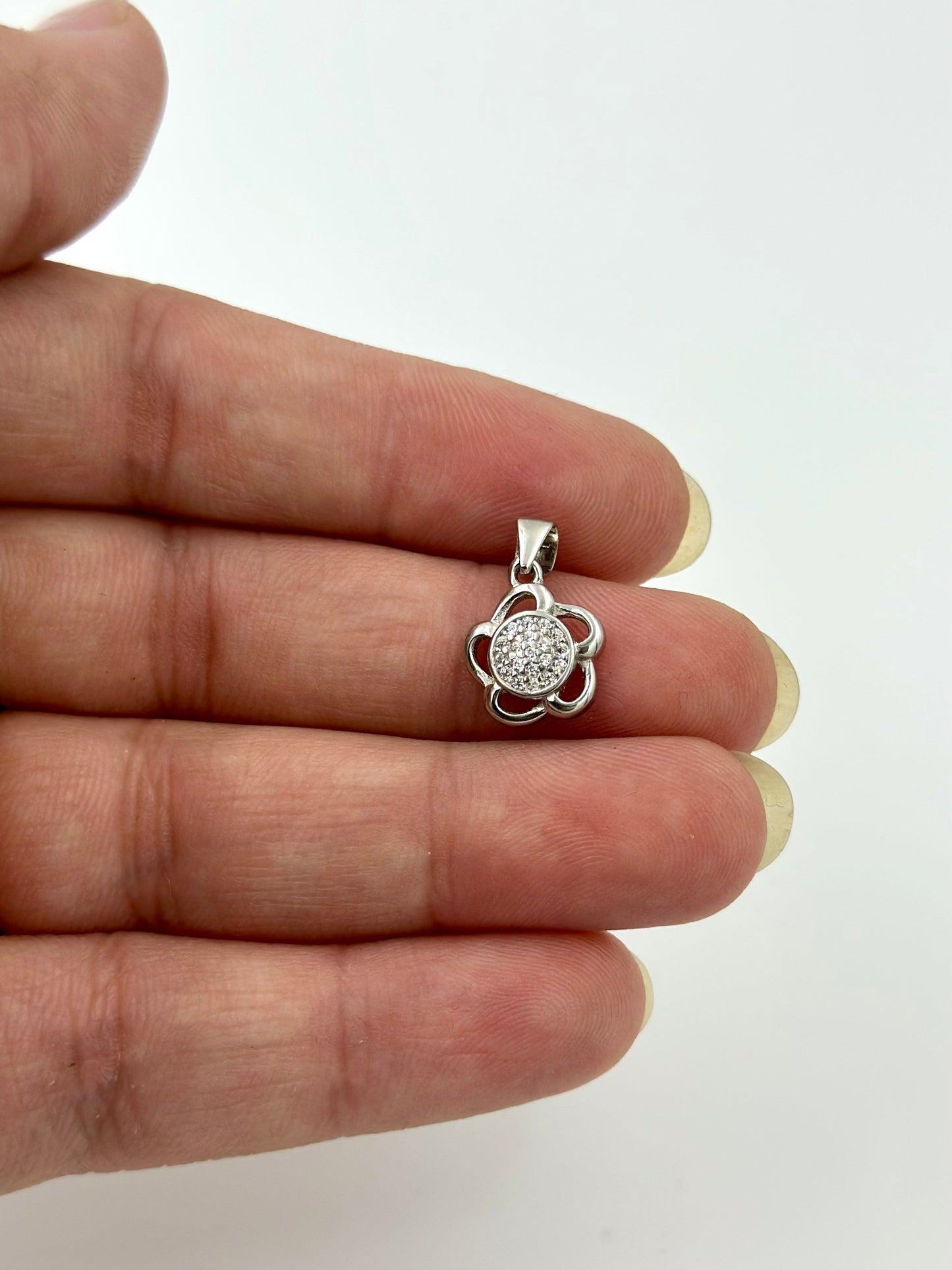 Zircon studded, star shaped sterling silver pendants