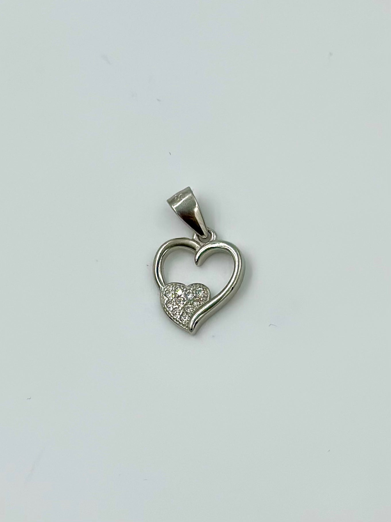 Heart shaped, zircon studded sterling silver pendants