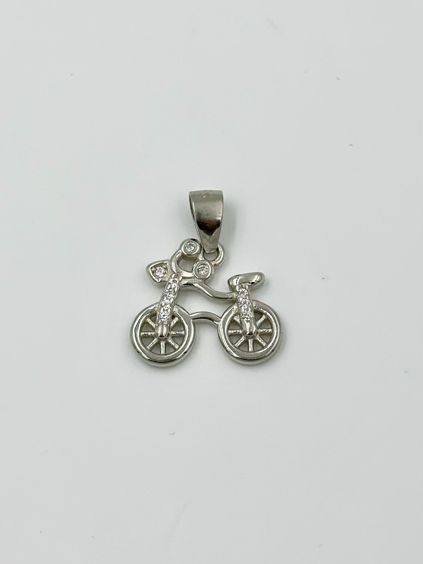 Bicycle shaped, zircon studded sterling silver pendant