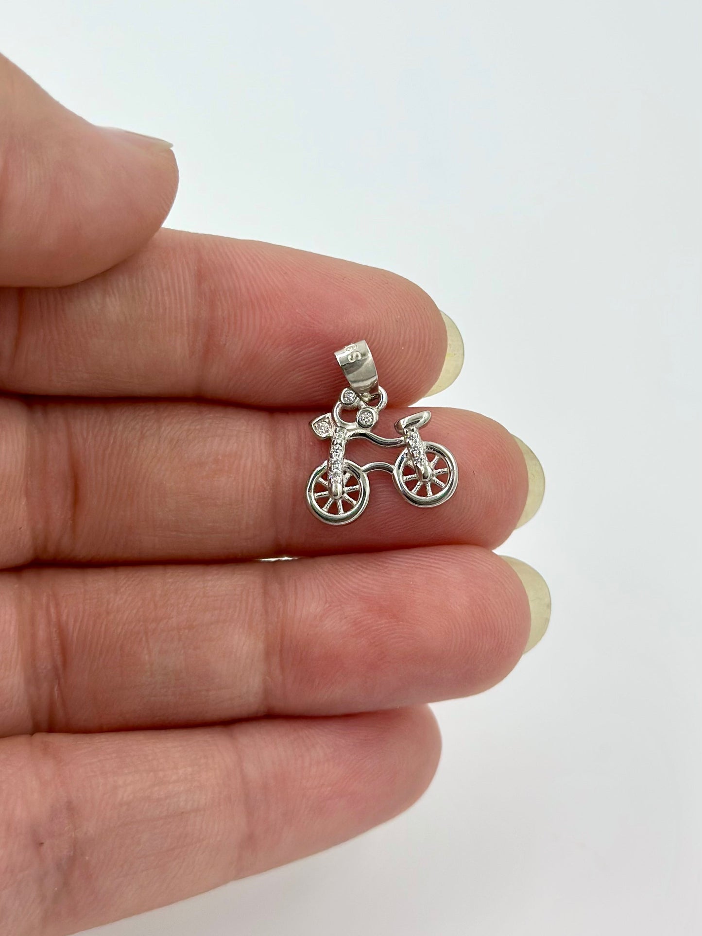 Bicycle shaped, zircon studded sterling silver pendant