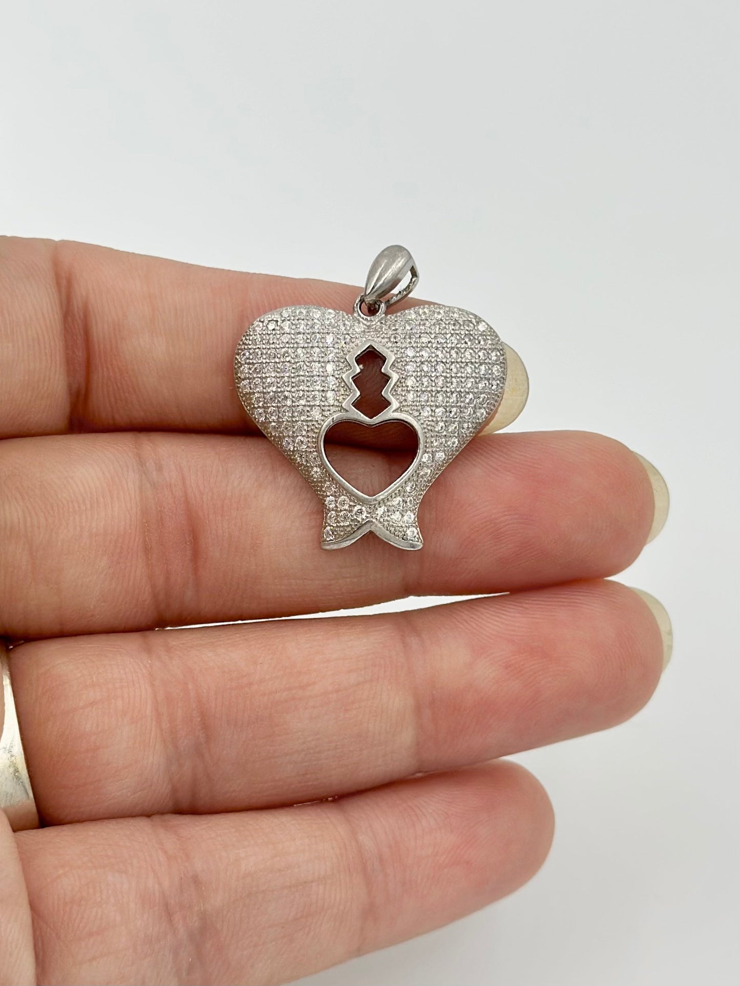Heart shaped, zircon studded sterling silver pendants