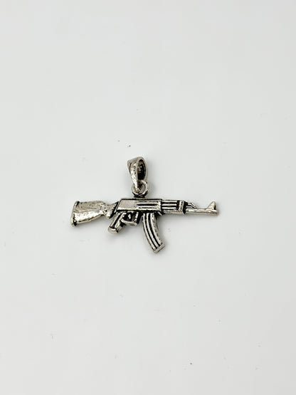Gun shaped, oxidised sterling silver pendants