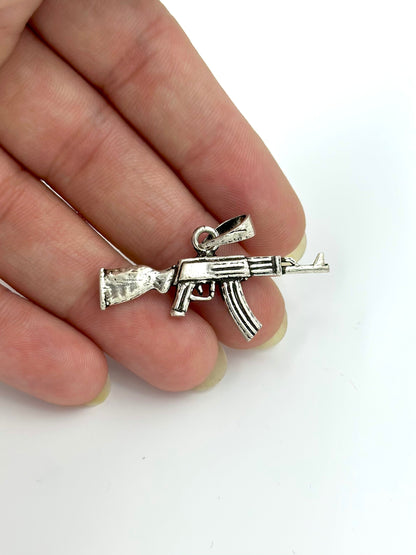 Gun shaped, oxidised sterling silver pendants