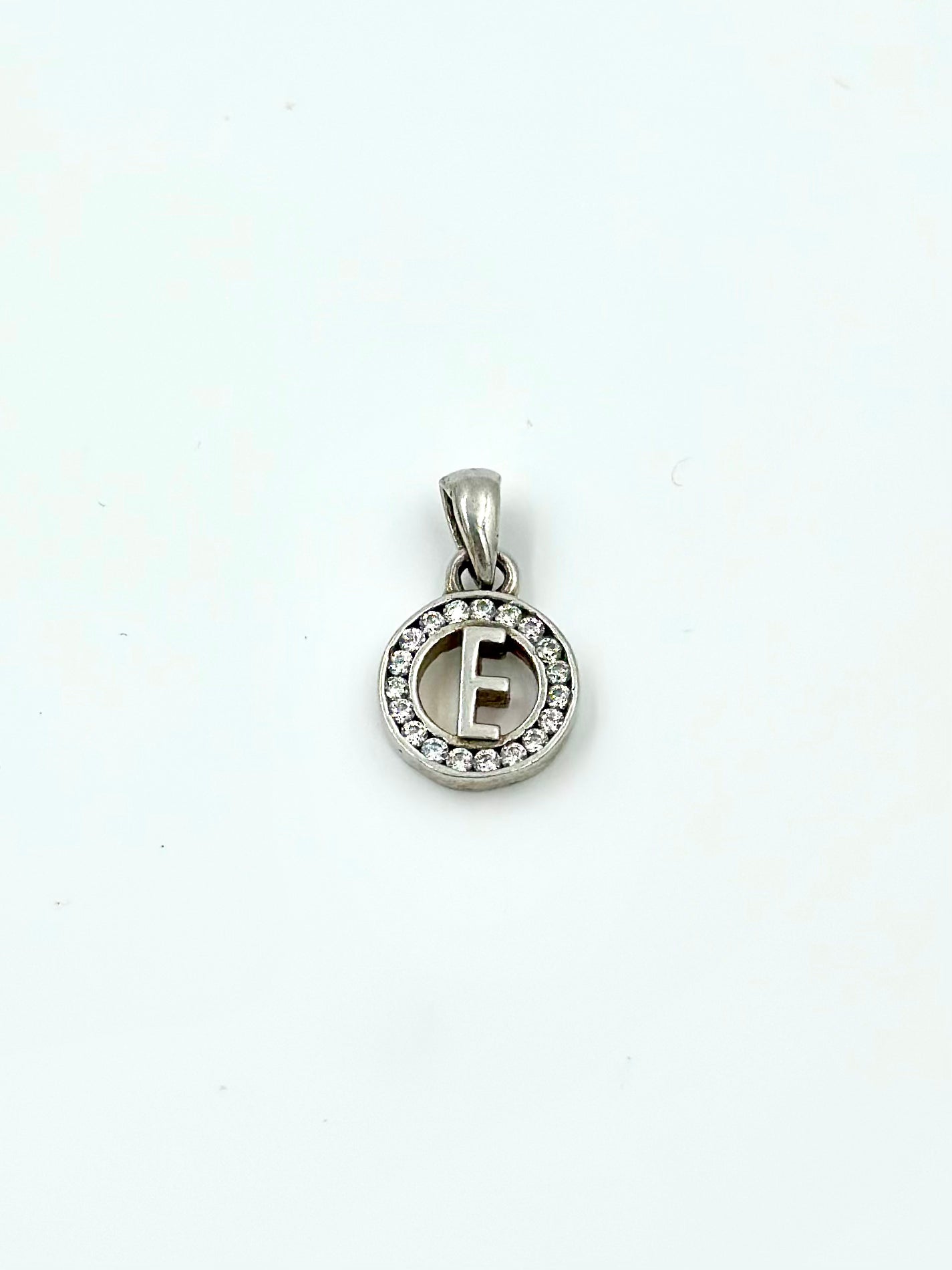 E shaped, zircon studded sterling silver pendant