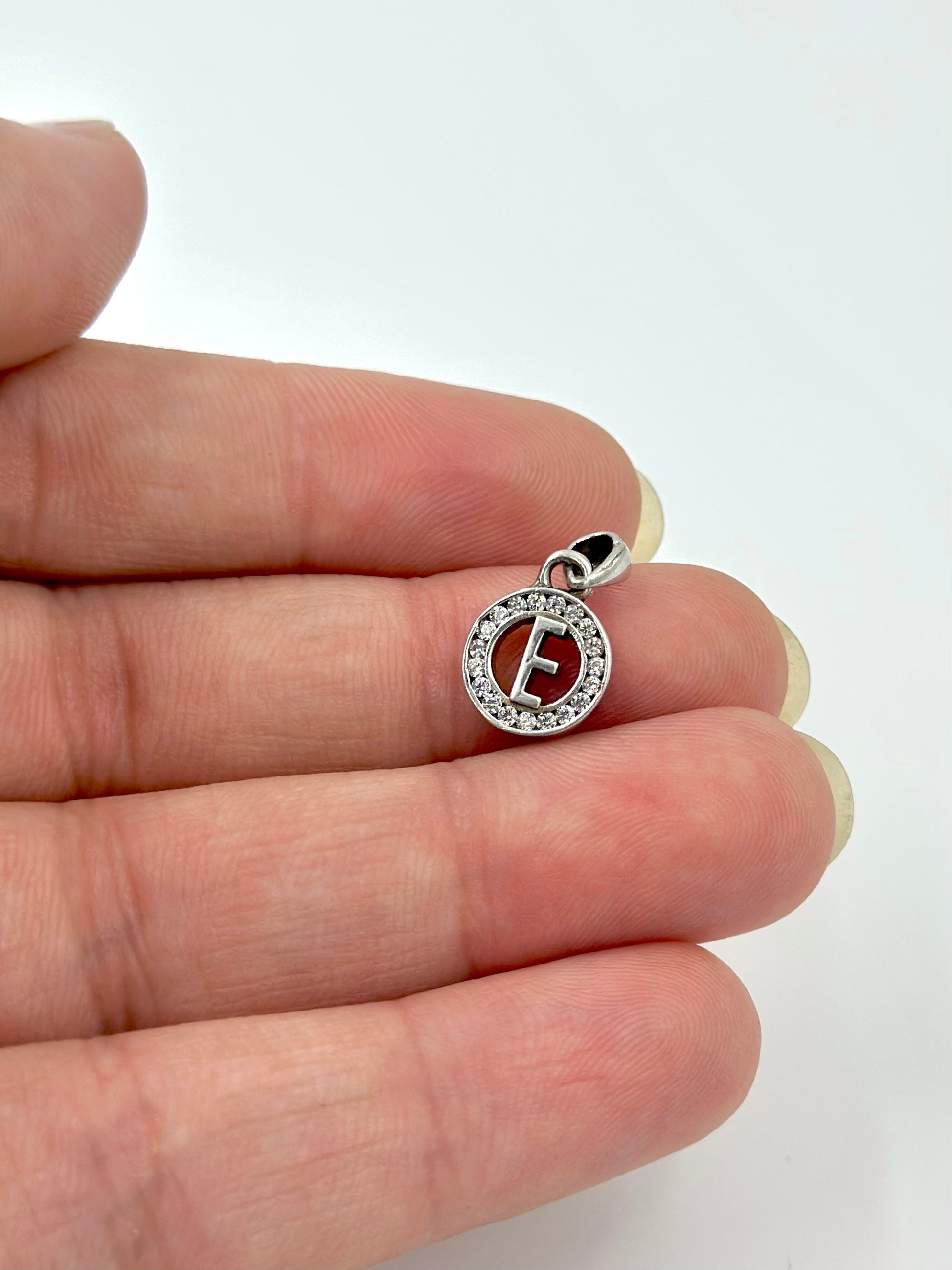 E shaped, zircon studded sterling silver pendant