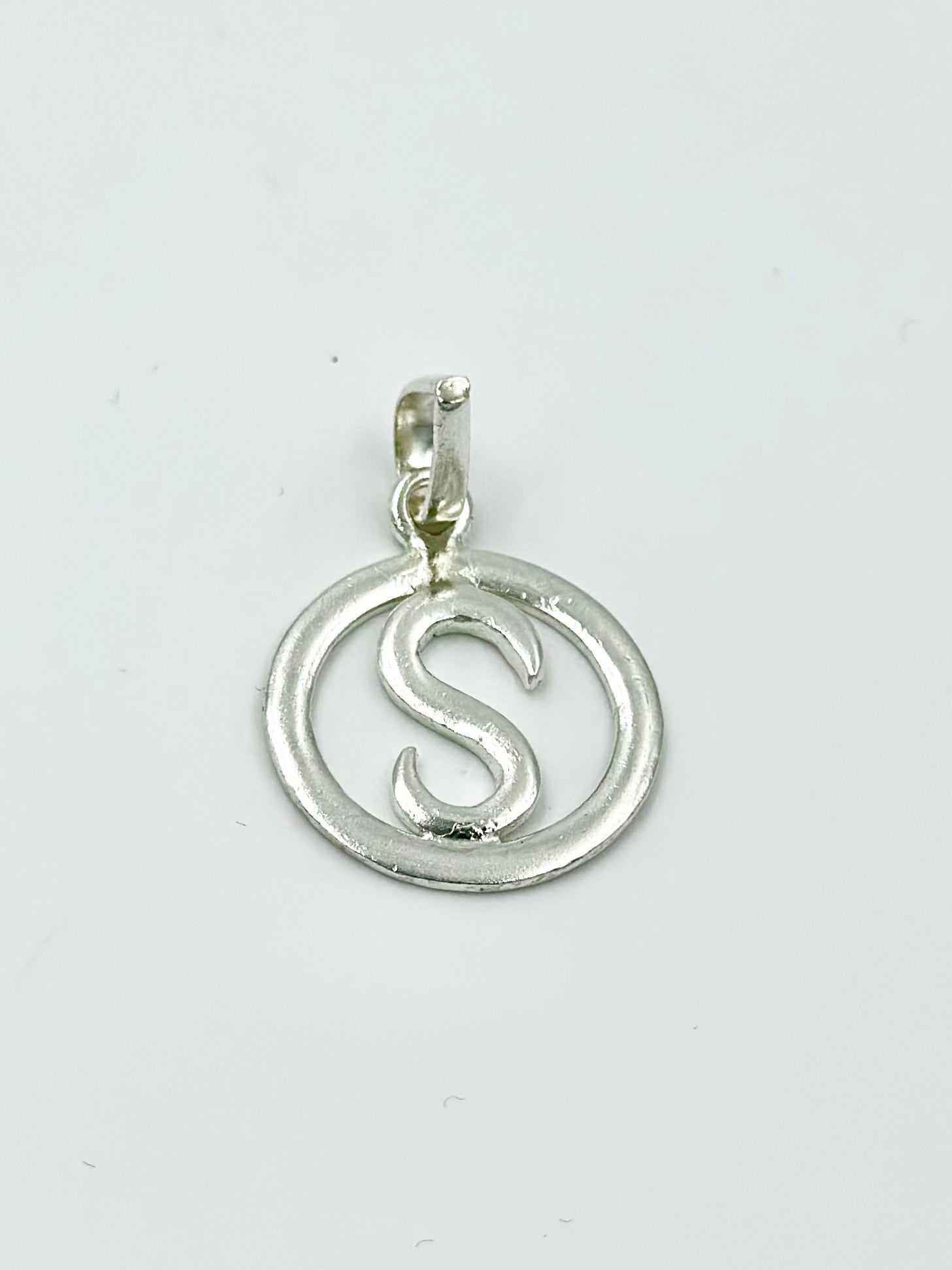 S shaped sterling silver pendant