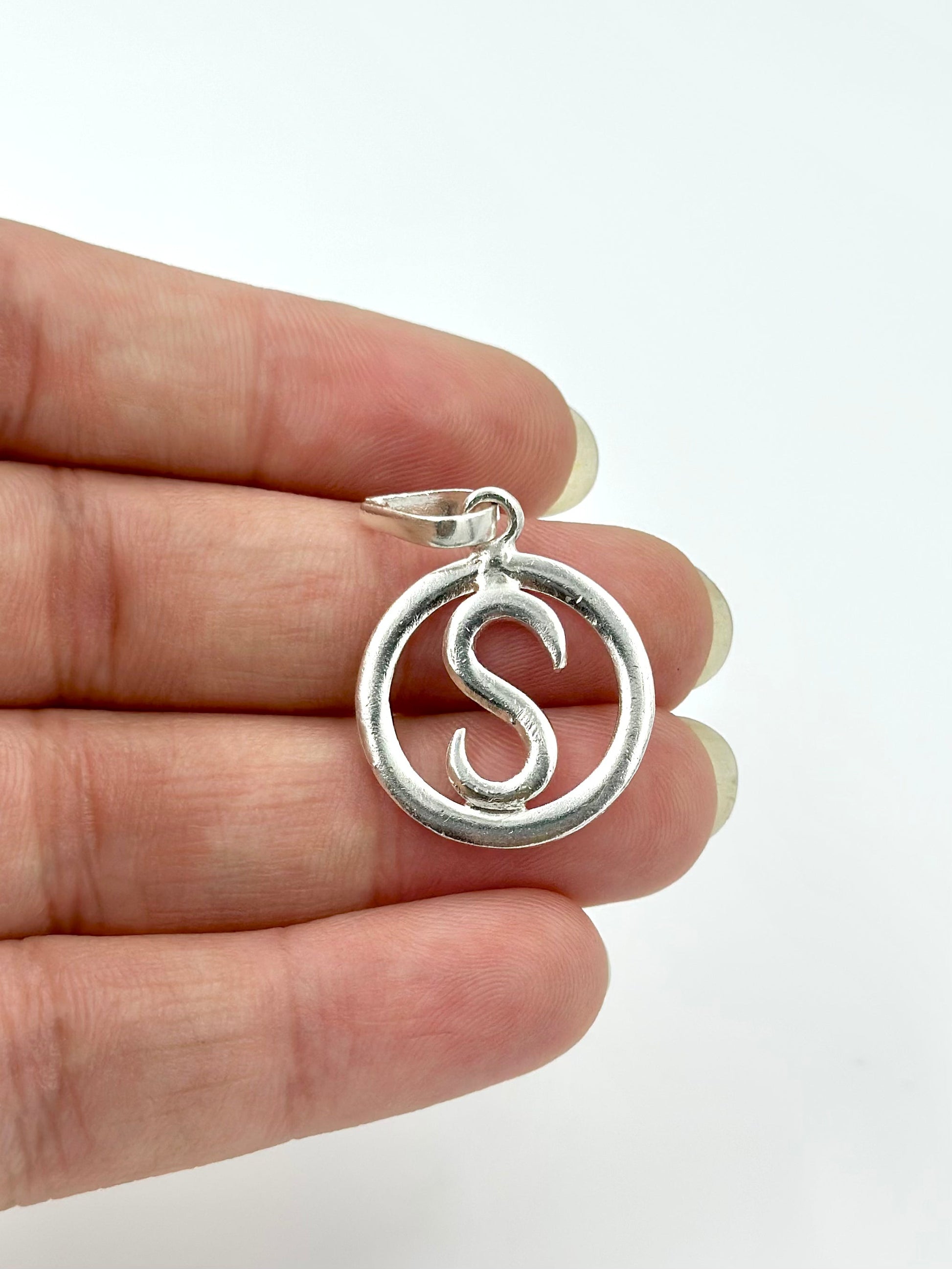 S shaped sterling silver pendant
